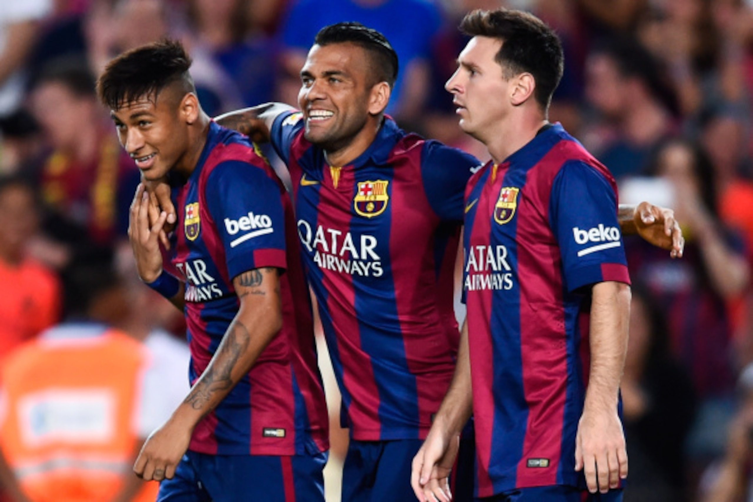 BARCELONA, SPAIN - AUGUST 18:  Lionel Messi of FC Barcelona celebrates with his teammates Neymar (L) and Dani Alves after scoring the opening goalduring the Joan Gamper Trophy match between FC Barcelona and Club Leon at Camp Nou on August 18, 2014 in Barc