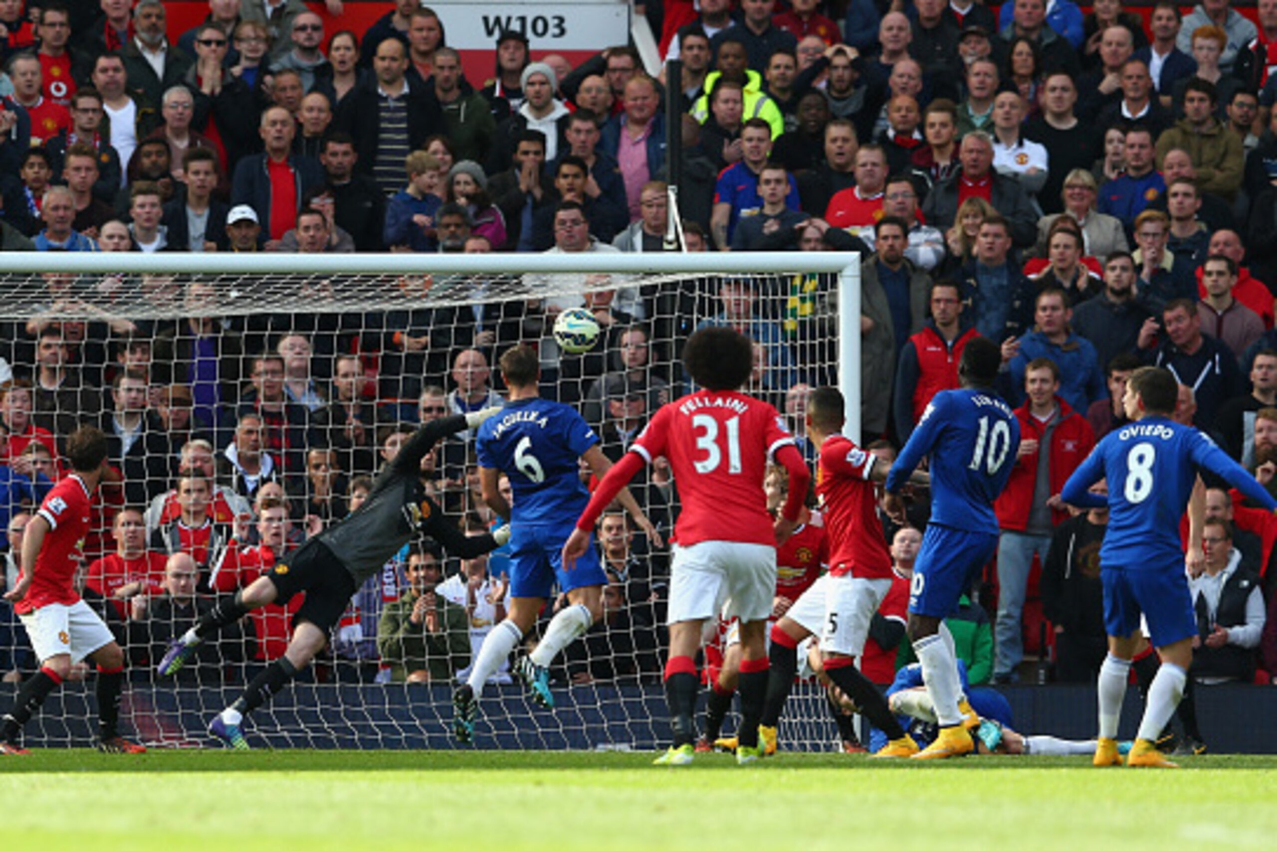 MANCHESTER, ENGLAND - OCTOBER 05:  David De Gea of Manchester United saves the shot of Bryan Oviedo of Everton during the Barclays Premier League match between Manchester United and Everton at Old Trafford on October 5, 2014 in Manchester, England.  (Phot