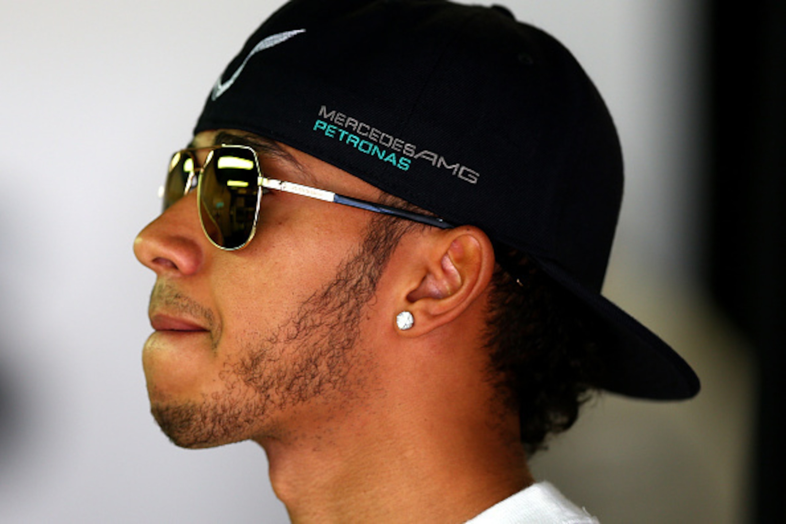 SOCHI, RUSSIA - OCTOBER 11:  SOCHI, RUSSIA - OCTOBER Lewis Hamilton of Great Britain and Mercedes GP looks on in the garage during final practice ahead of the Russian Formula One Grand Prix at Sochi Autodrom on October 11, 2014 in Sochi, Russia.  (Photo b