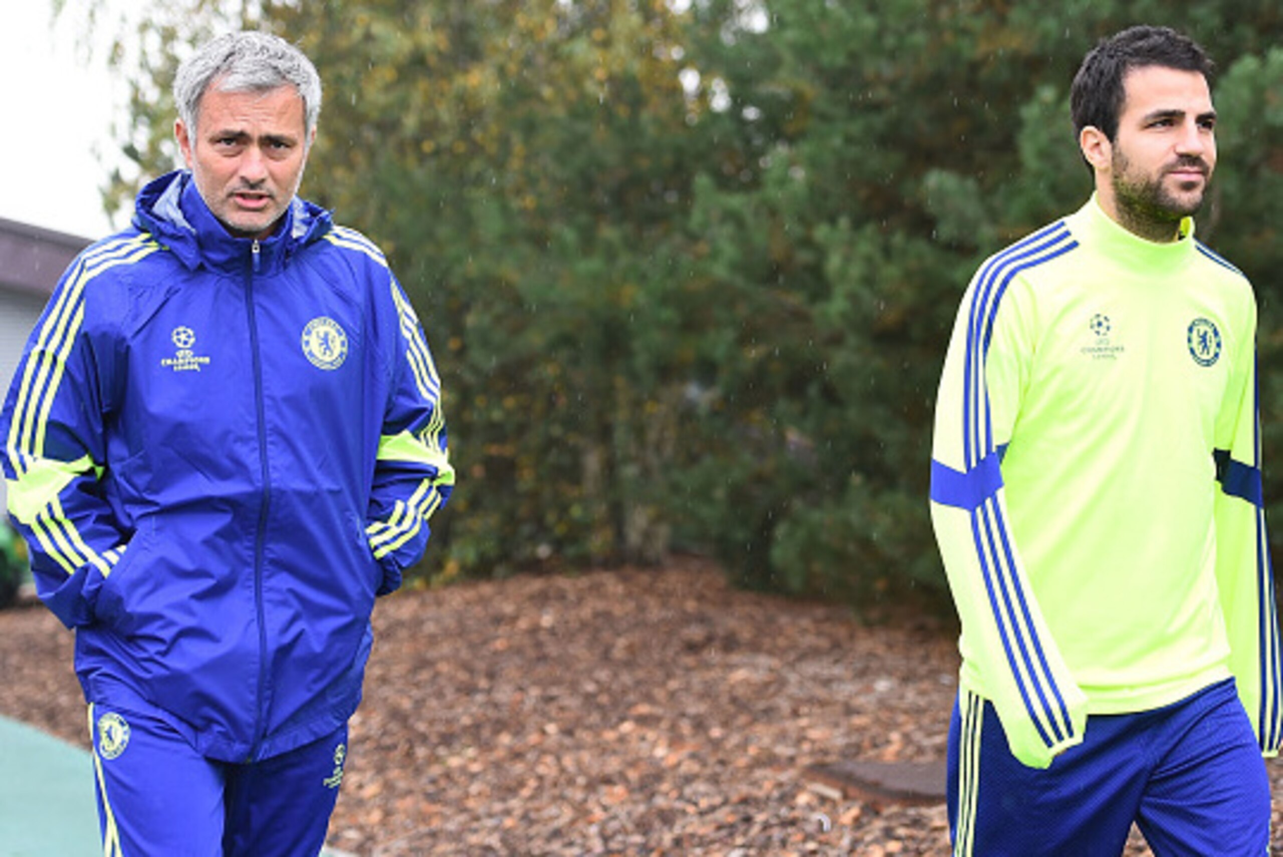 COBHAM, ENGLAND - SEPTEMBER 29:  Manager Jose Mourinho and Cesc Fabregas walks out onto the training pitch during the Chelsea Training Session at Chelsea Training Ground on September 29, 2014 in Cobham, England.  (Photo by Christopher Lee/Getty Images)