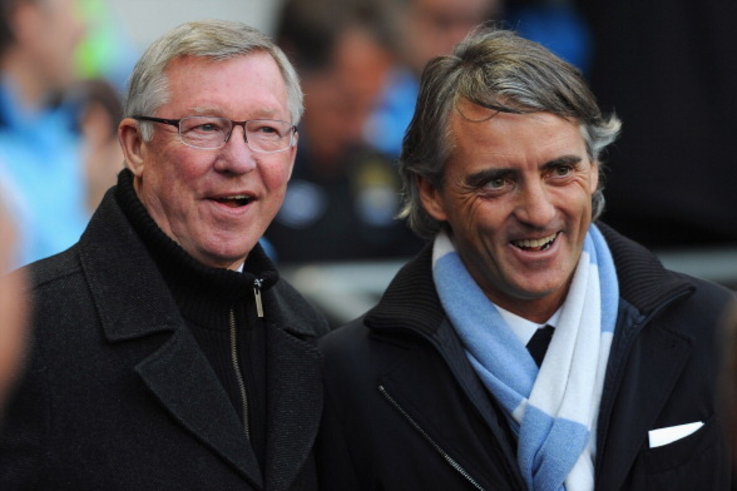 MANCHESTER, ENGLAND - APRIL 30: Manchester United manager Sir Alex Ferguson and Manchester City manager Roberto Mancini look on before the Barclays Premier League match between Manchester City and Manchester United at Etihad Stadium on April 30, 2012 in M