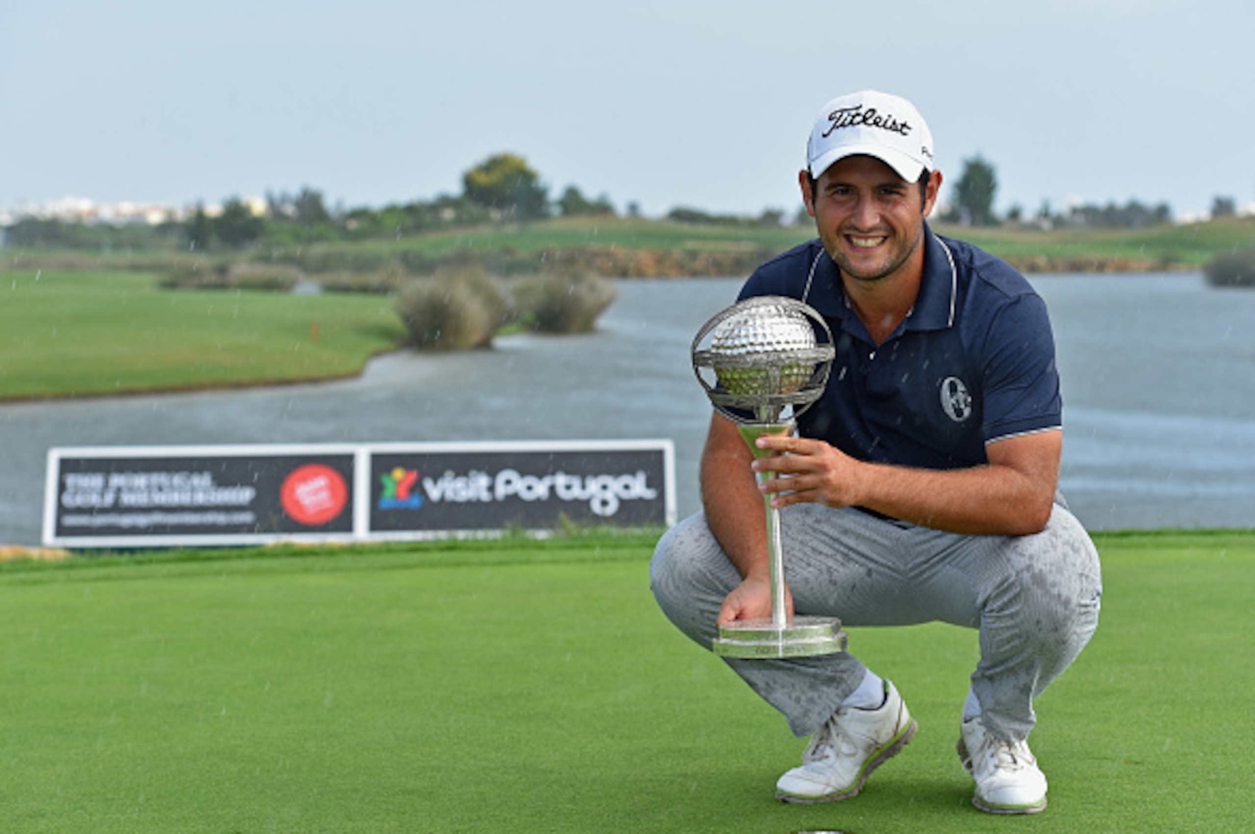 ALBUFEIRA, PORTUGAL - OCTOBER 12:  Alexander Levy of France with the winners trophy after the cancellation of the final round of the Portugal Masters at Oceanico Victoria Golf Club on October 12, 2014 in Albufeira, Portugal.  (Photo by Stuart Franklin/Get