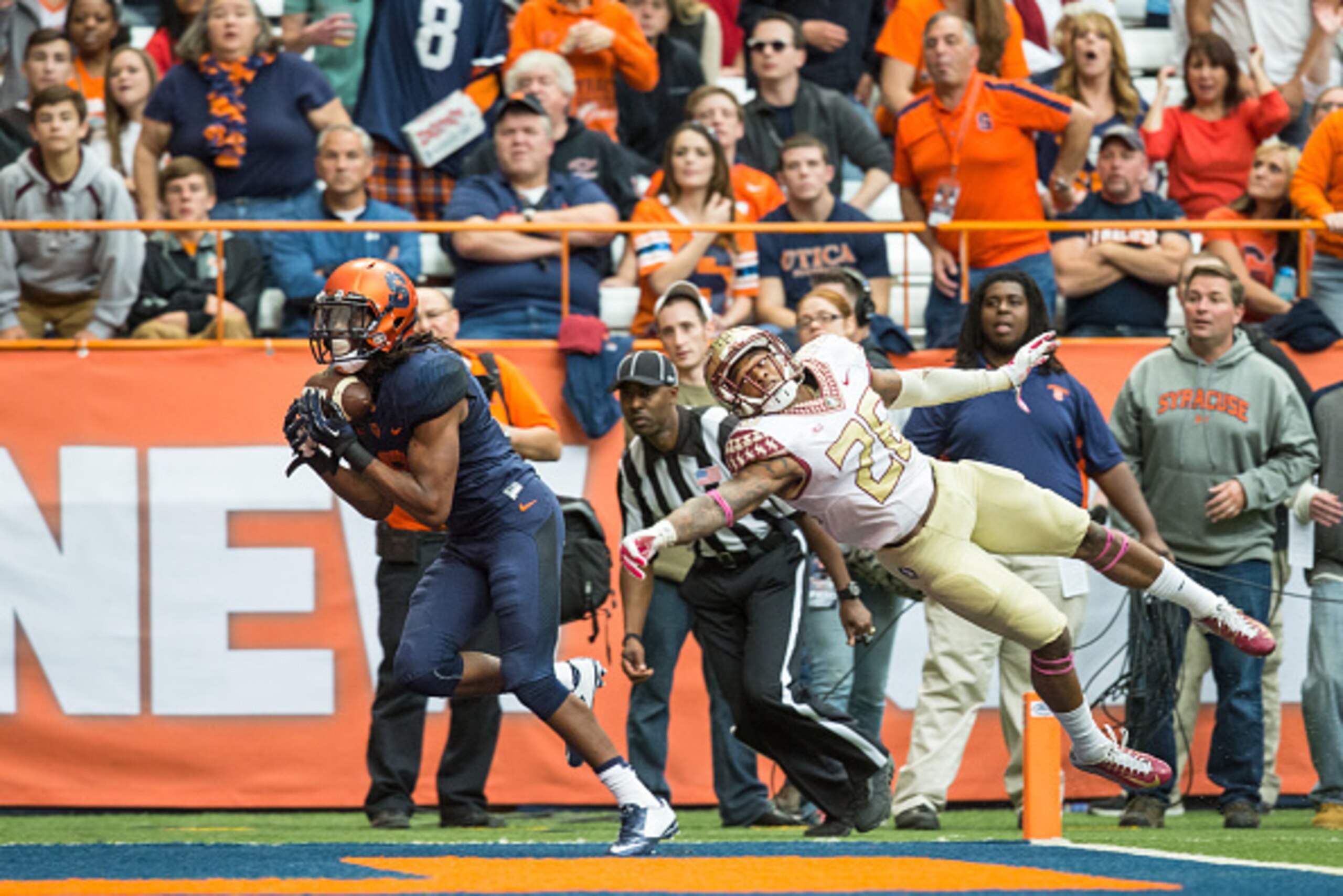 SYRACUSE, NY - OCTOBER 11:  Steve Ishmael #8 of the Syracuse Orange brings in a touchdown reception just out of the reach of P.J. Williams #26 of the Florida State Seminoles during the third quarter on October 11, 2014 at The Carrier Dome in Syracuse, New