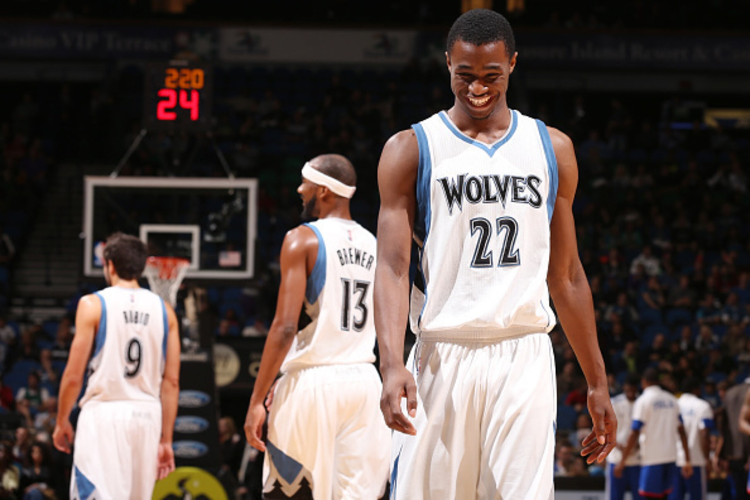 MINNEAPOLIS, MN - OCTOBER 10:  Andrew Wiggins #22 of the Minnesota Timberwolves smiles as he walks down the court during the gamen against the Philadelphia 76ers on October 10, 2014 at Target Center in Minneapolis, Minnesota. NOTE TO USER: User expressly 