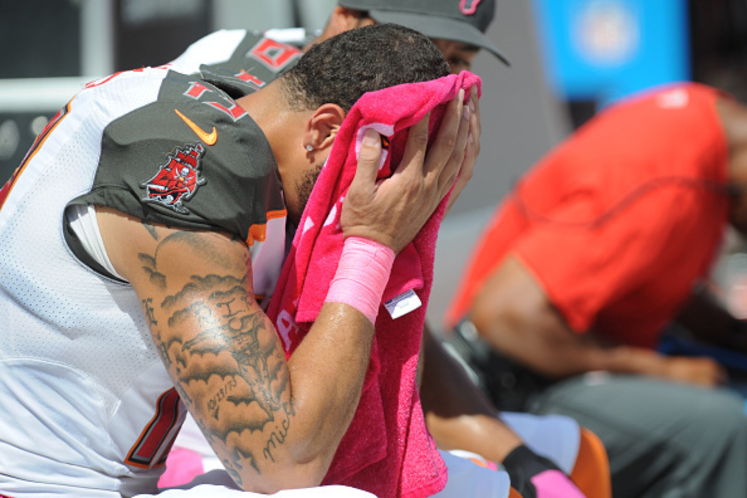 TAMPA, FL - OCTOBER 12:  Wide receiver Mike Evans #13 of the Tampa Bay Buccaneers sits on the sidelines during the game against the Baltimore Ravens at Raymond James Stadium on October 12, 2014 in Tampa, Florida. (Photo by Cliff McBride/Getty Images)