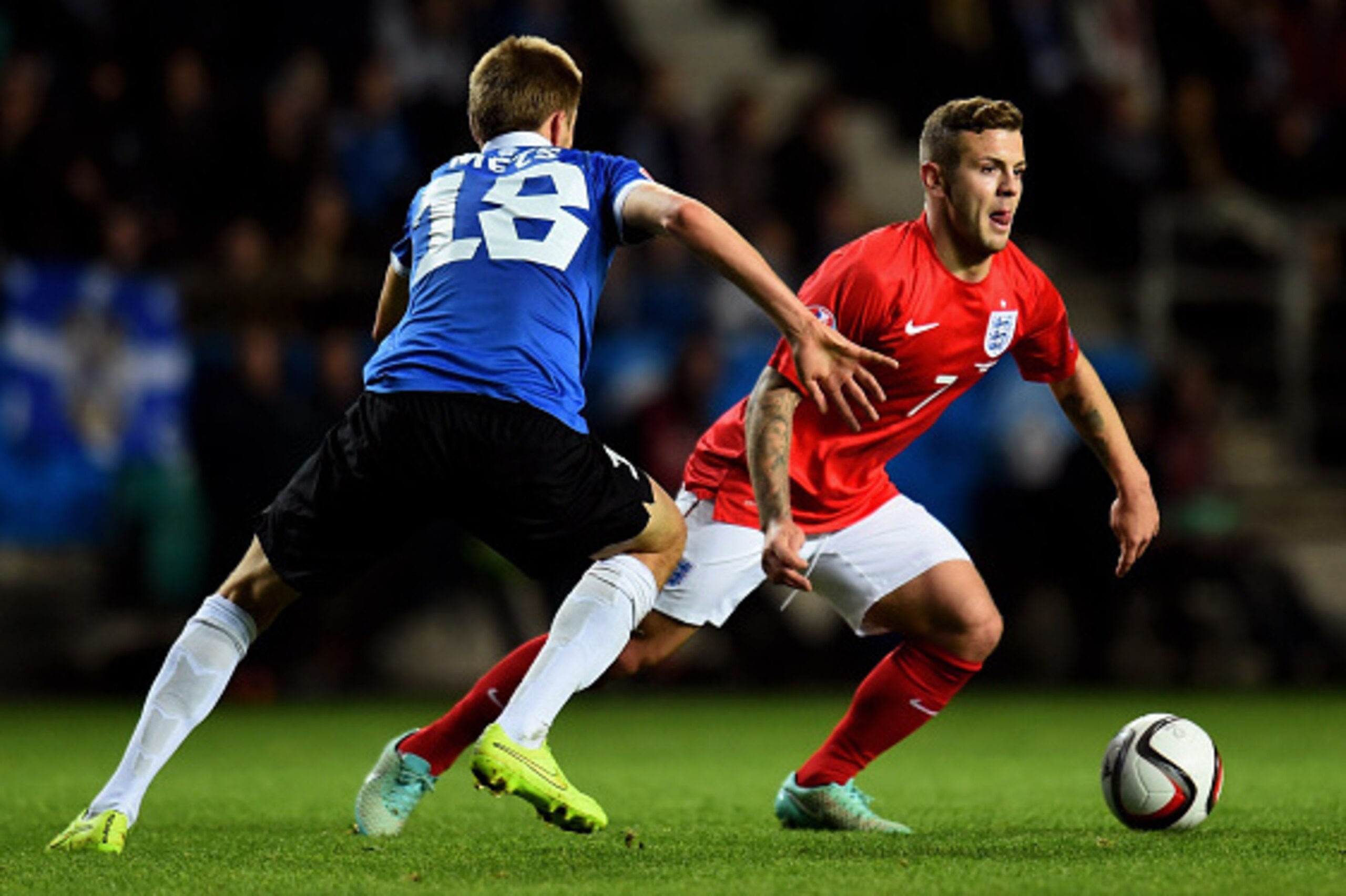 TALLINN, ESTONIA - OCTOBER 12:  Jack Wilshere of England is challenged by Karol Mets of Estonia during the EURO 2016 Qualifier match between Estonia and England at A. Le Coq Arena on October 12, 2014 in Tallinn, Estonia.  (Photo by Shaun Botterill/Getty I