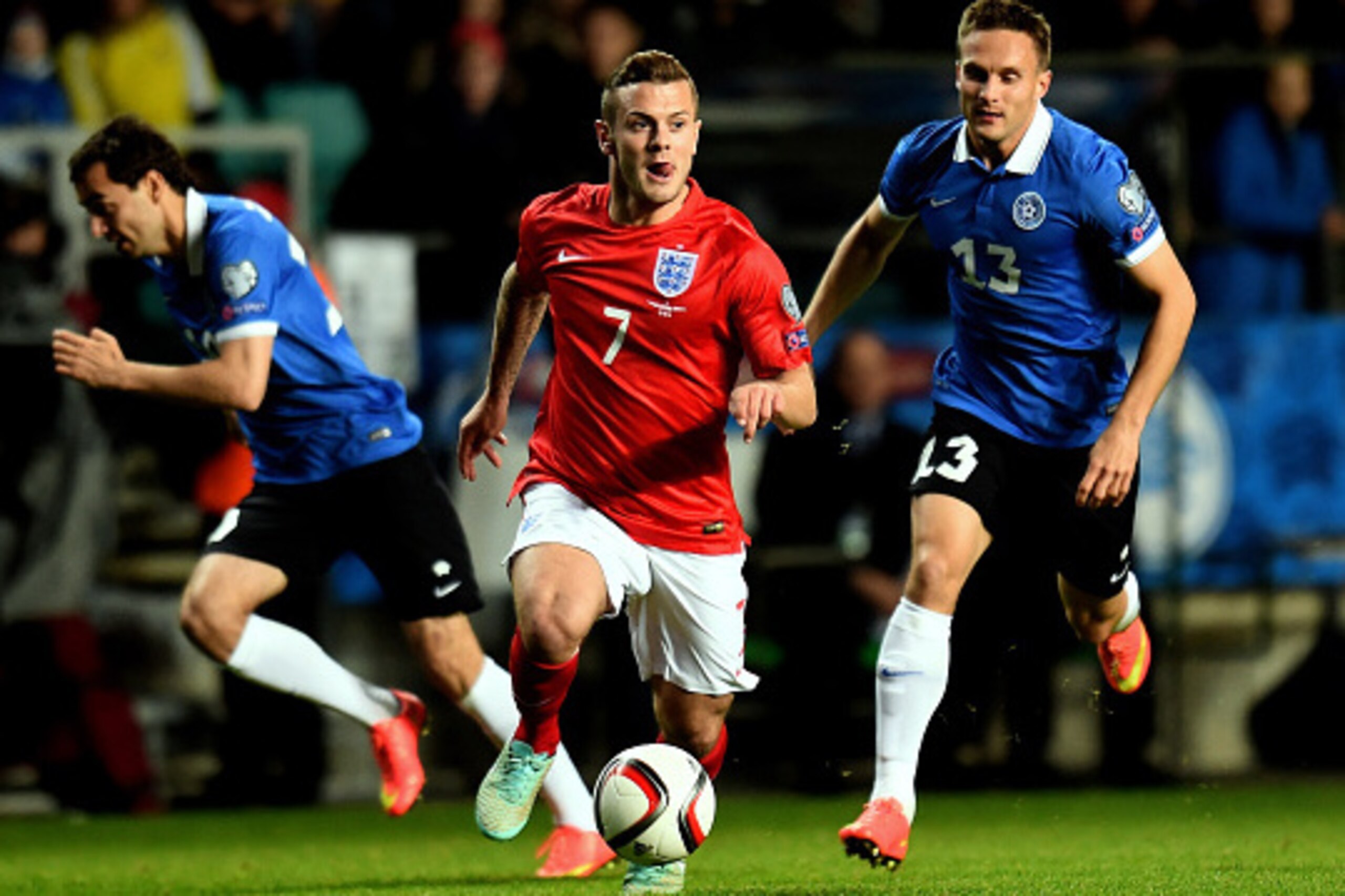TALLINN, ESTONIA - OCTOBER 12:  Jack Wilshere of England is pursued by Martin Vunk of Estonia during the EURO 2016 Qualifier match between Estonia and England at A. Le Coq Arena on October 12, 2014 in Tallinn, Estonia.  (Photo by Shaun Botterill/Getty Ima