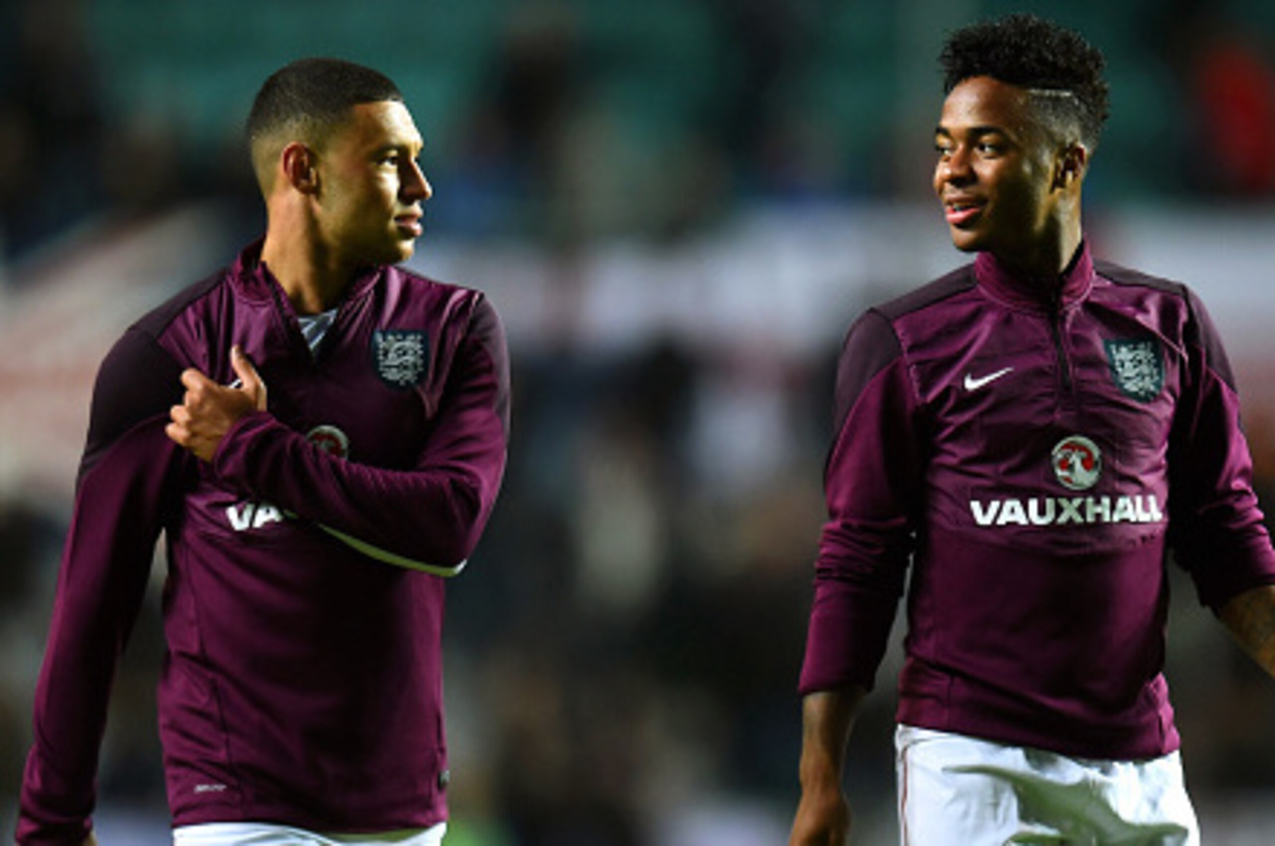 TALLINN, ESTONIA - OCTOBER 12:  Substitutes Alex Oxlade-Chamberlain and Raheem Sterling of England warm up during the EURO 2016 Qualifier match between Estonia and England at A. Le Coq Arena on October 12, 2014 in Tallinn, Estonia.  (Photo by Shaun Botter