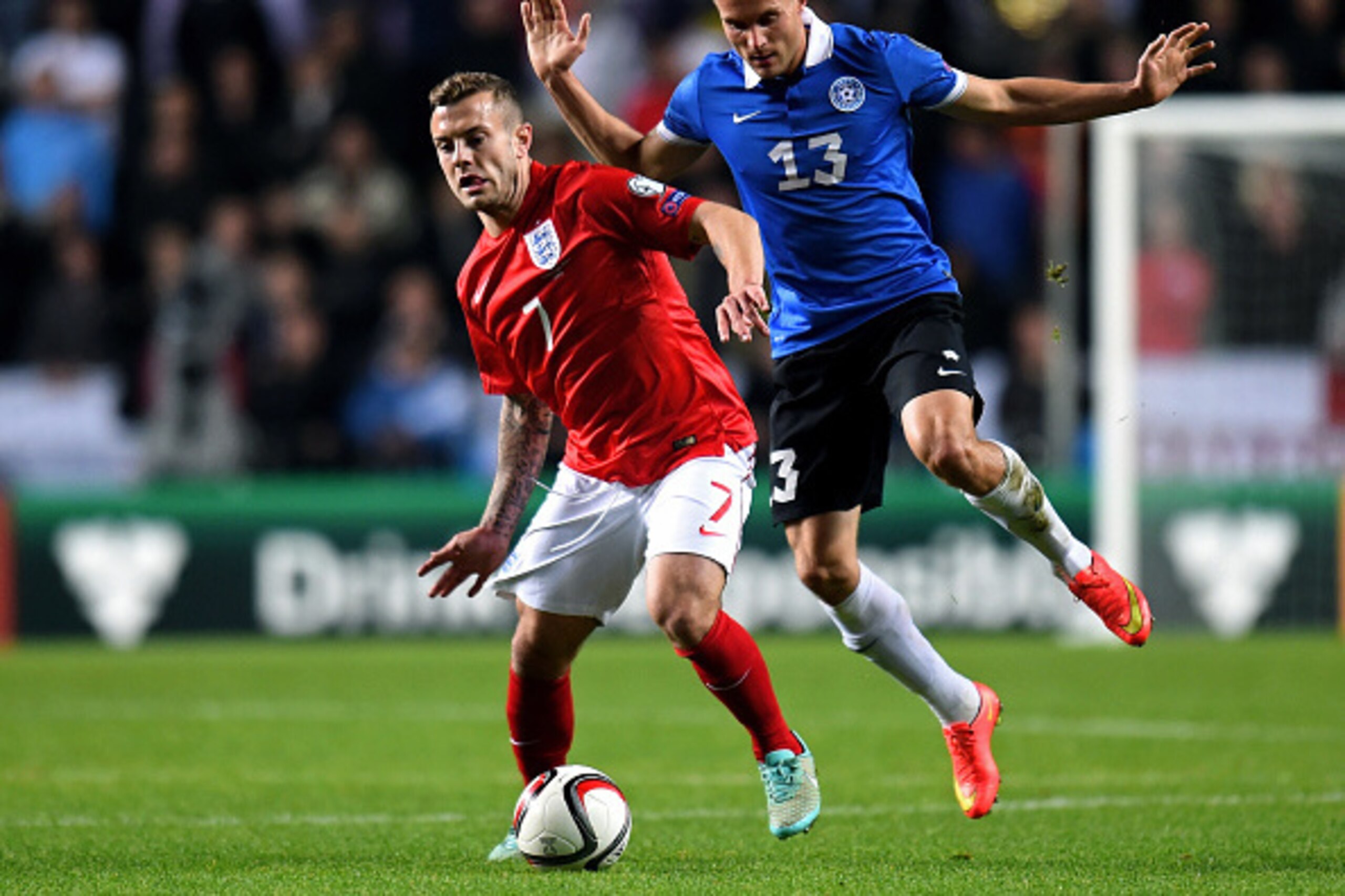 TALLINN, ESTONIA - OCTOBER 12:  Jack Wilshere of England goes past the challenge from Martin Vunk of Estonia during the EURO 2016 Qualifier match between Estonia and England at A. Le Coq Arena on October 12, 2014 in Tallinn, Estonia.  (Photo by Shaun Bott