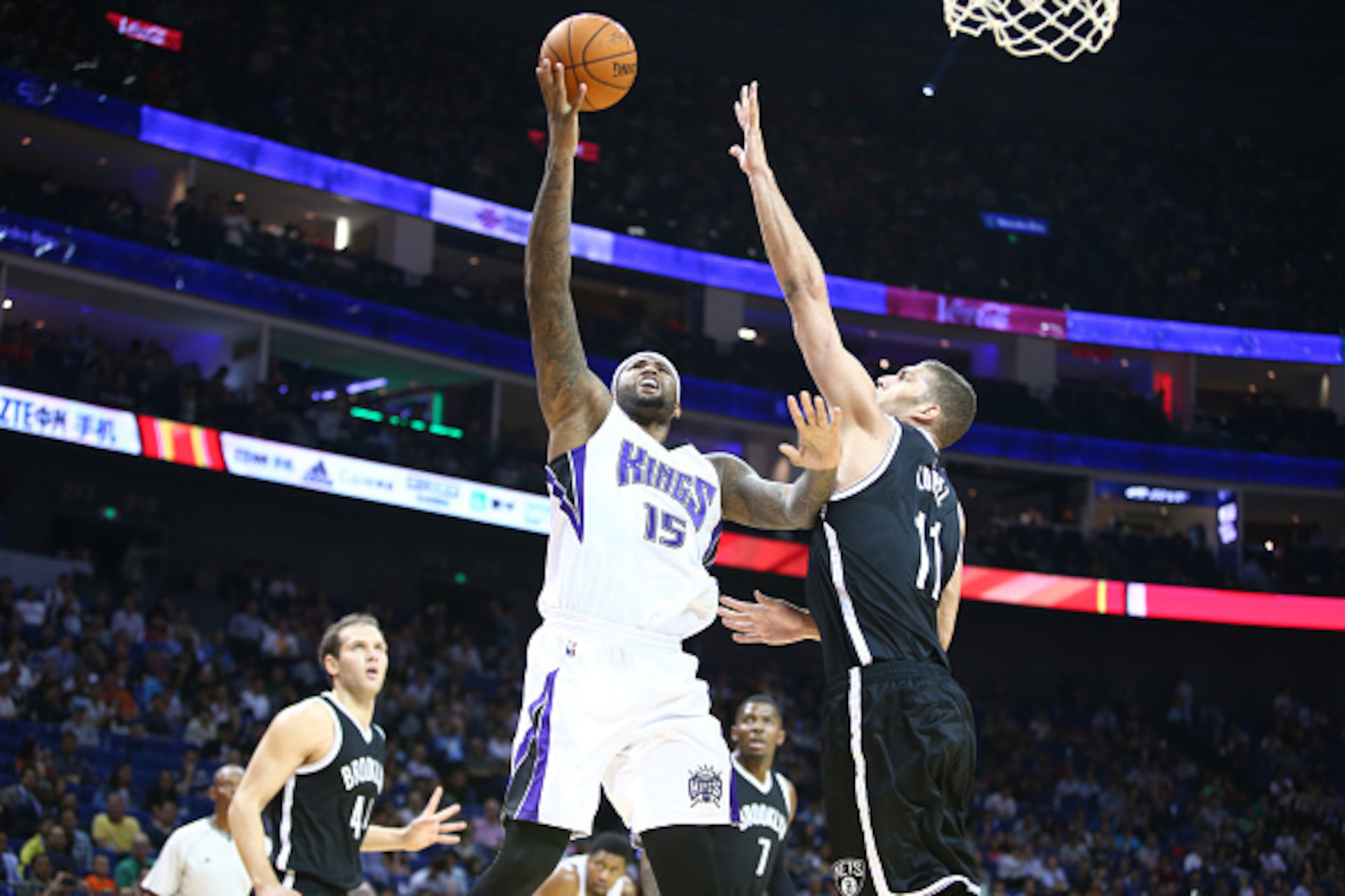 SHANGHAI, CHINA - OCTOBER 12: DeMarcus Cousins #15 of the Sacramento Kings shoots against  Brook Lopez #11 of the Brooklyn Nets during the 2014 NBA Global Games at the Mercedes-Benz Arena on October 12, 2014 at the Mercedes-Benz Arena in Shanghai, China.N