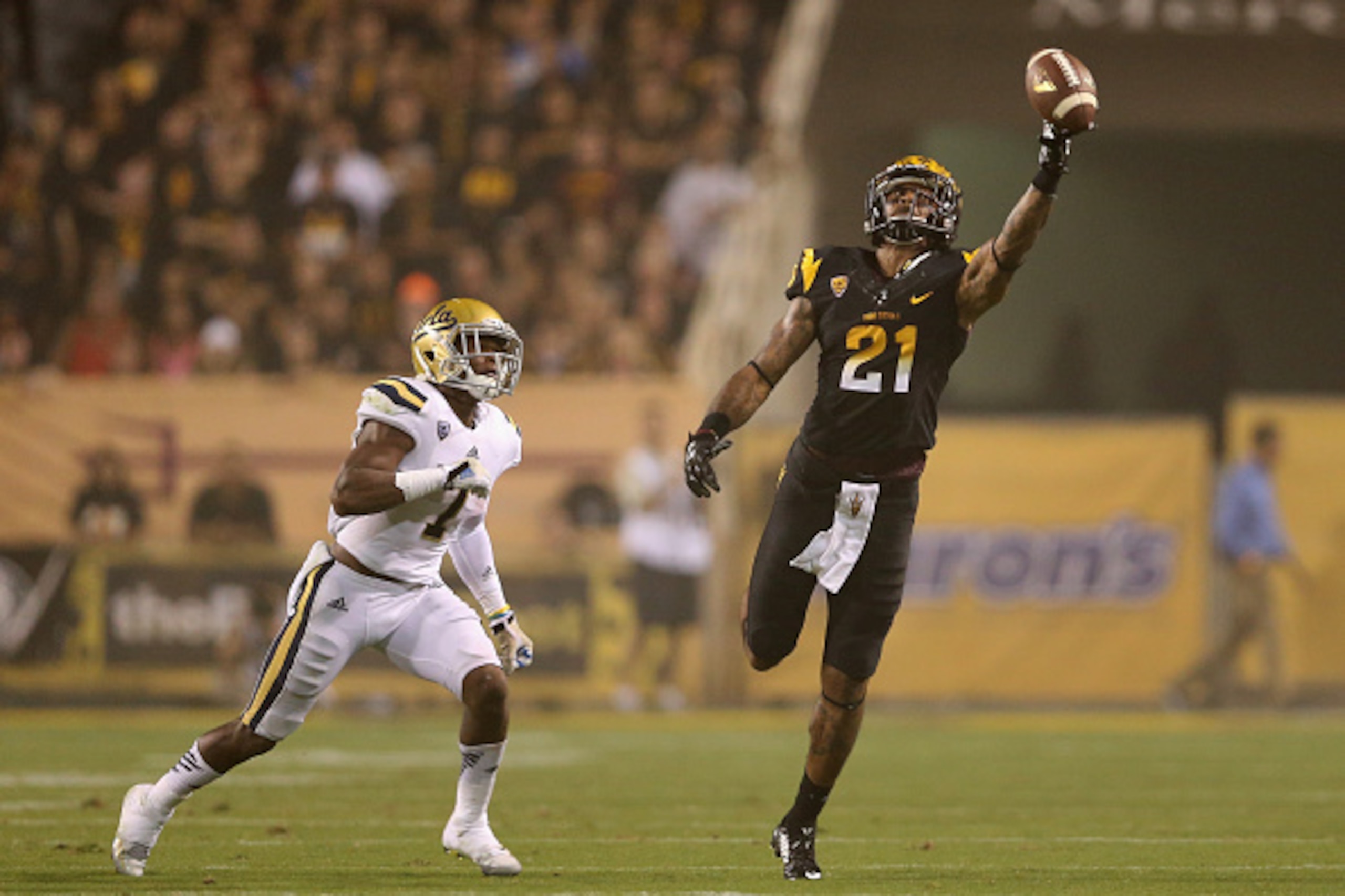 TEMPE, AZ - SEPTEMBER 25:  Wide receiver Jaelen Strong #21 of the Arizona State Sun Devils attempts to make a catch on an incomplete pass over defensive back John Johnson #7 of the UCLA Bruins during the college football game at Sun Devil Stadium on Septe