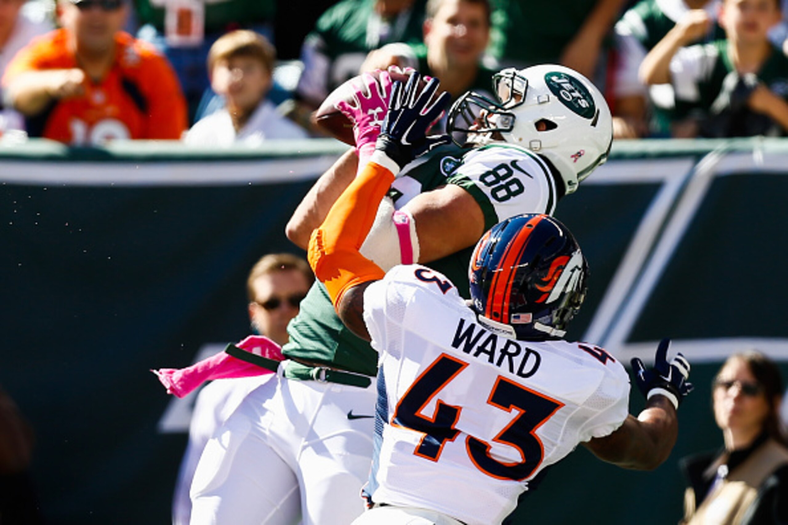 EAST RUTHERFORD, NJ - OCTOBER 12: Jace Amaro #88 of the New York Jets makes a catch in the endzone over T.J. Ward #43 of the Denver Broncos in the first quarter at MetLife Stadium on October 12, 2014 in East Rutherford, New Jersey. (Photo by Jeff Zelevan EAST RUTHERFORD, NJ - OCTOBER 12: Jace Amaro #88 of the New York Jets makes a catch in the endzone over T.J. Ward #43 of the Denver Broncos in the first quarter at MetLife Stadium on October 12, 2014 in East Rutherford, New Jersey. (Photo by Jeff Zelevan
