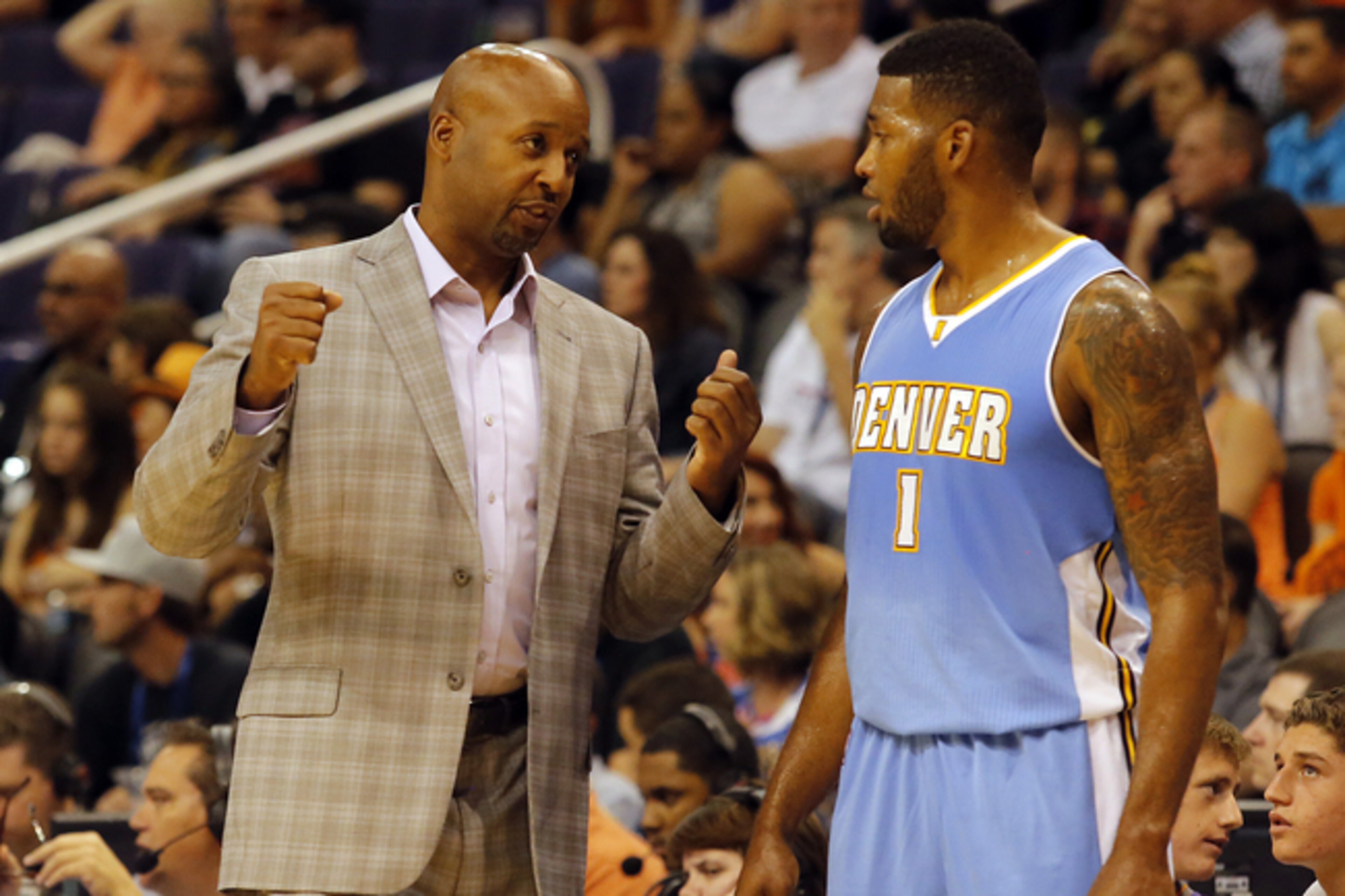 Denver Nuggets coach Brian Shaw instructing Alonzo Gee during a preseason game. Denver Nuggets coach Brian Shaw instructing Alonzo Gee during a preseason game.