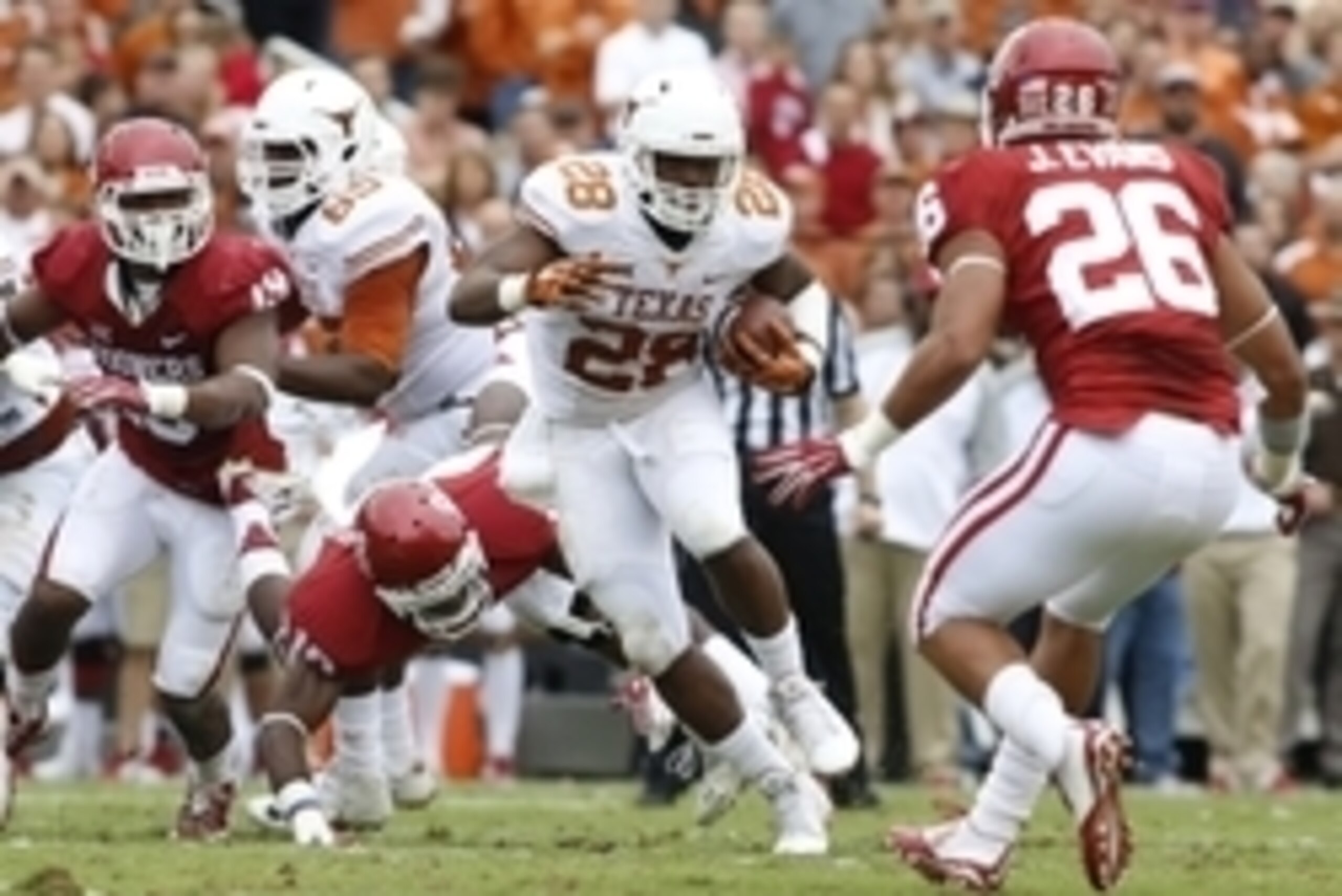 Oct 11, 2014; Dallas, TX, USA; Texas Longhorns running back Malcolm Brown (28) runs the ball in the second quarter against the Oklahoma Sooners at the Cotton Bowl. Mandatory Credit: Tim Heitman-USA TODAY Sports