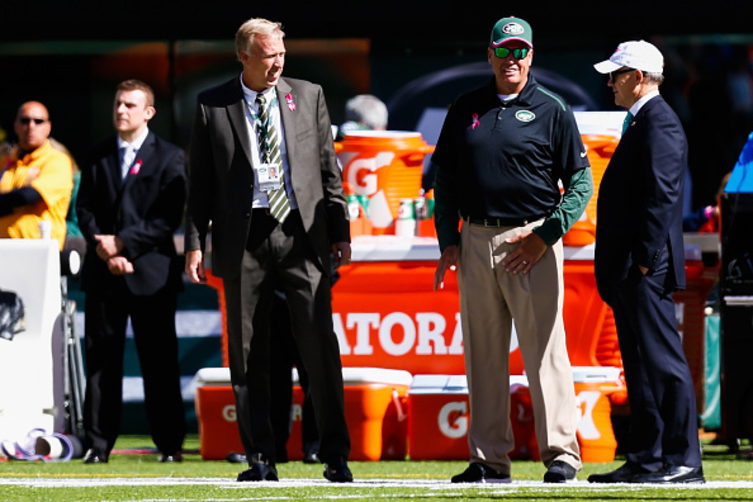 EAST RUTHERFORD, NJ - OCTOBER 12: New York Jets general manager John Idzik (L) stands with head coach Rex Ryan (C) and owner Woody Johnson (R) before a game against the Denver Broncos at MetLife Stadium on October 12, 2014 in East Rutherford, New Jersey. 