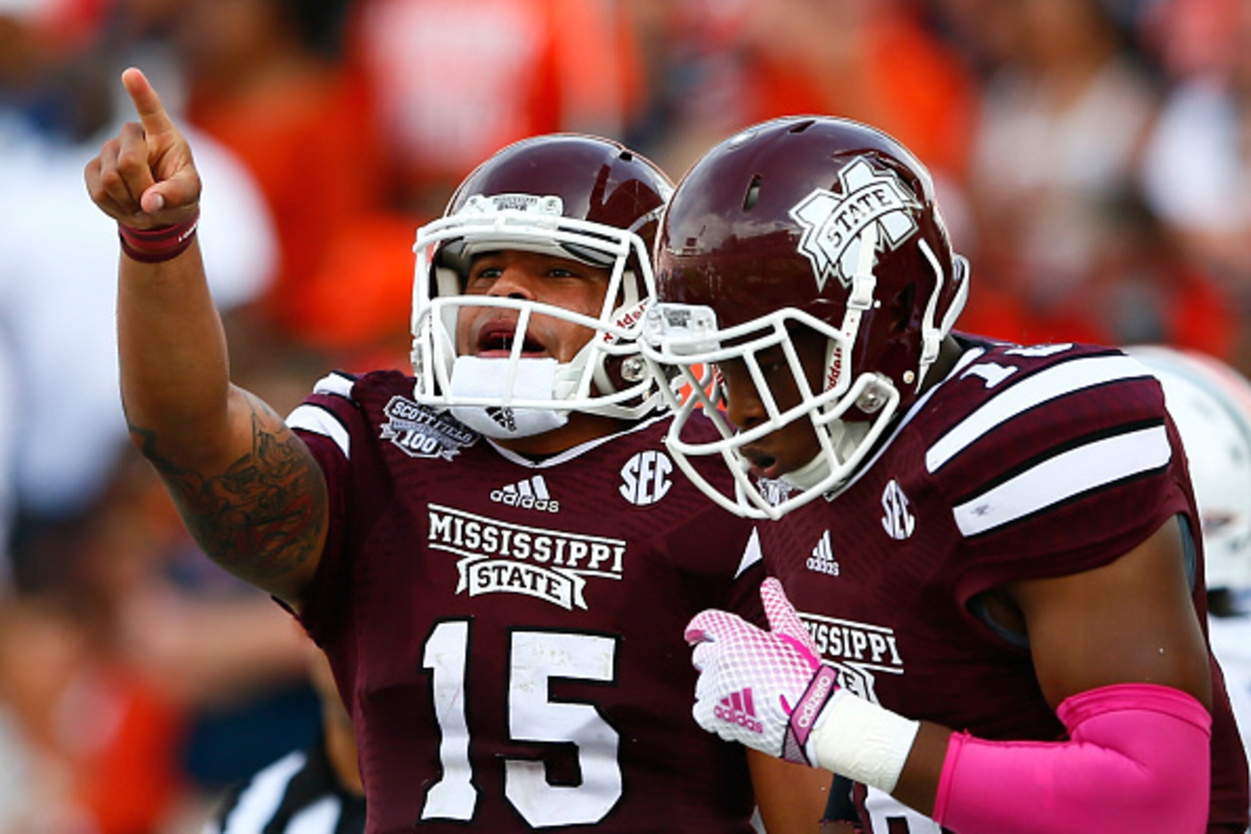 STARKVILLE, MS - OCTOBER 11:  Dak Prescott #15 of the Mississippi State Bulldogs reacts after rushing for a touchdown against the Auburn Tigers with Brandon Hill #18 at Davis Wade Stadium on October 11, 2014 in Starkville, Mississippi.  (Photo by Kevin C.