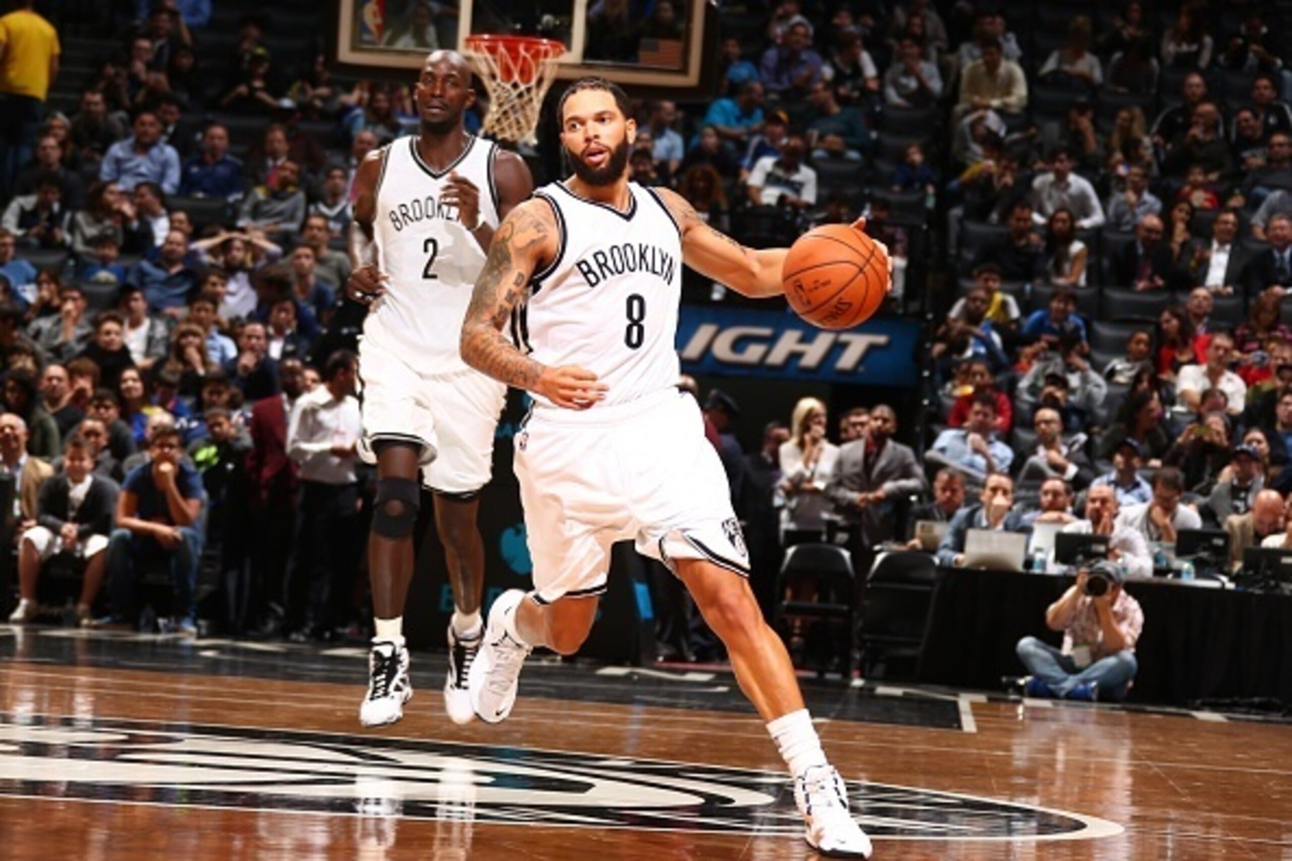 NEW YORK, NY - OCTOBER 7: Deron Williams #8 of the Brooklyn Nets handles the ball during the game against thr Maccabi Tel Aviv at the Barclays Center on October 7, 2014 in the Brooklyn borough of New York City. NOTE TO USER: User expressly acknowledges a NEW YORK, NY - OCTOBER 7: Deron Williams #8 of the Brooklyn Nets handles the ball during the game against thr Maccabi Tel Aviv at the Barclays Center on October 7, 2014 in the Brooklyn borough of New York City. NOTE TO USER: User expressly acknowledges a