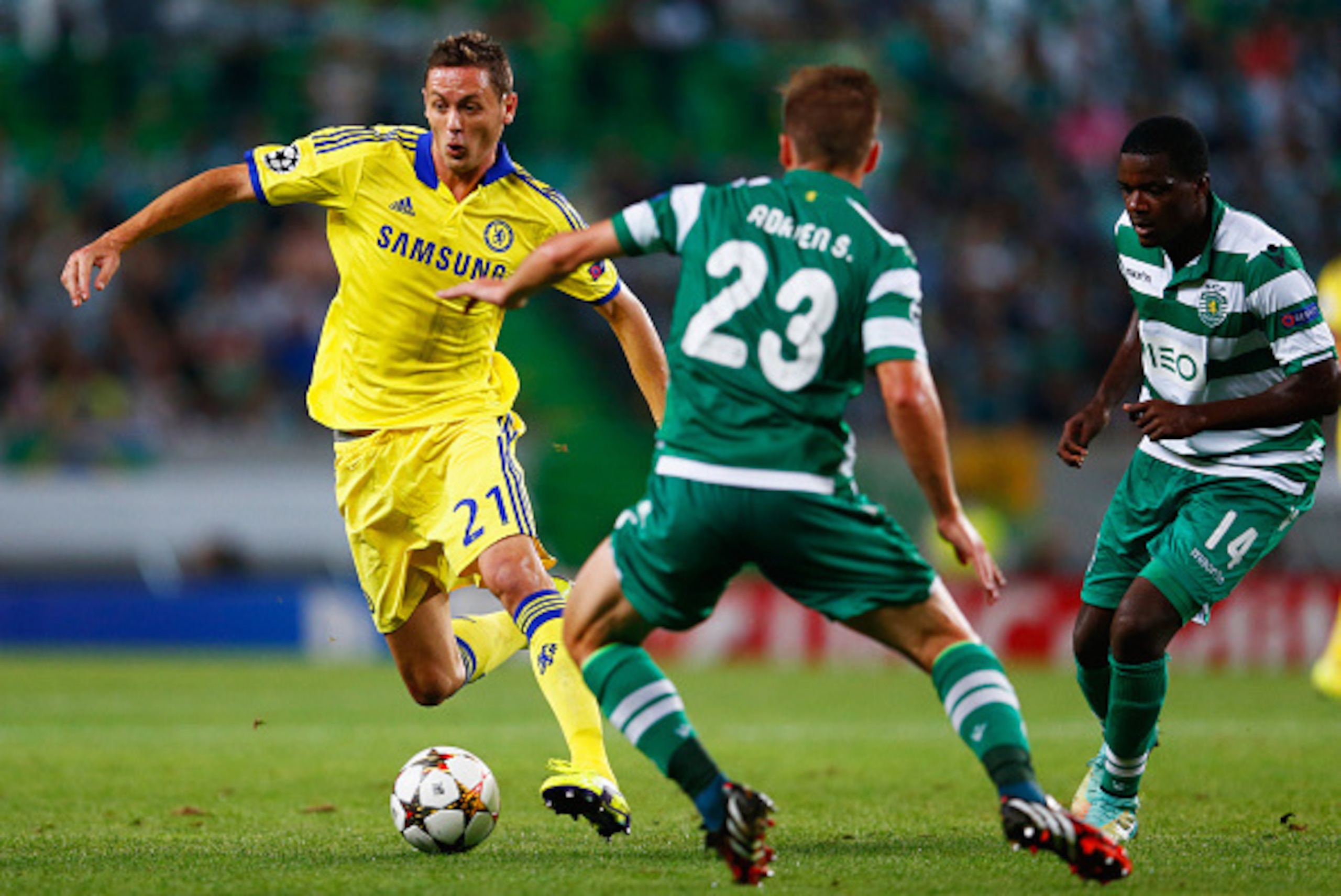 LISBON, PORTUGAL - SEPTEMBER 30: Nemanja Matic of Chelsea takes on Adrien Silva (23) and William Carvalho (14) of Sporting Lisbon during the UEFA Champions League Group G match between Sporting Clube de Portugal and Chelsea FC at Estadio Jose Alvalade on LISBON, PORTUGAL - SEPTEMBER 30: Nemanja Matic of Chelsea takes on Adrien Silva (23) and William Carvalho (14) of Sporting Lisbon during the UEFA Champions League Group G match between Sporting Clube de Portugal and Chelsea FC at Estadio Jose Alvalade on