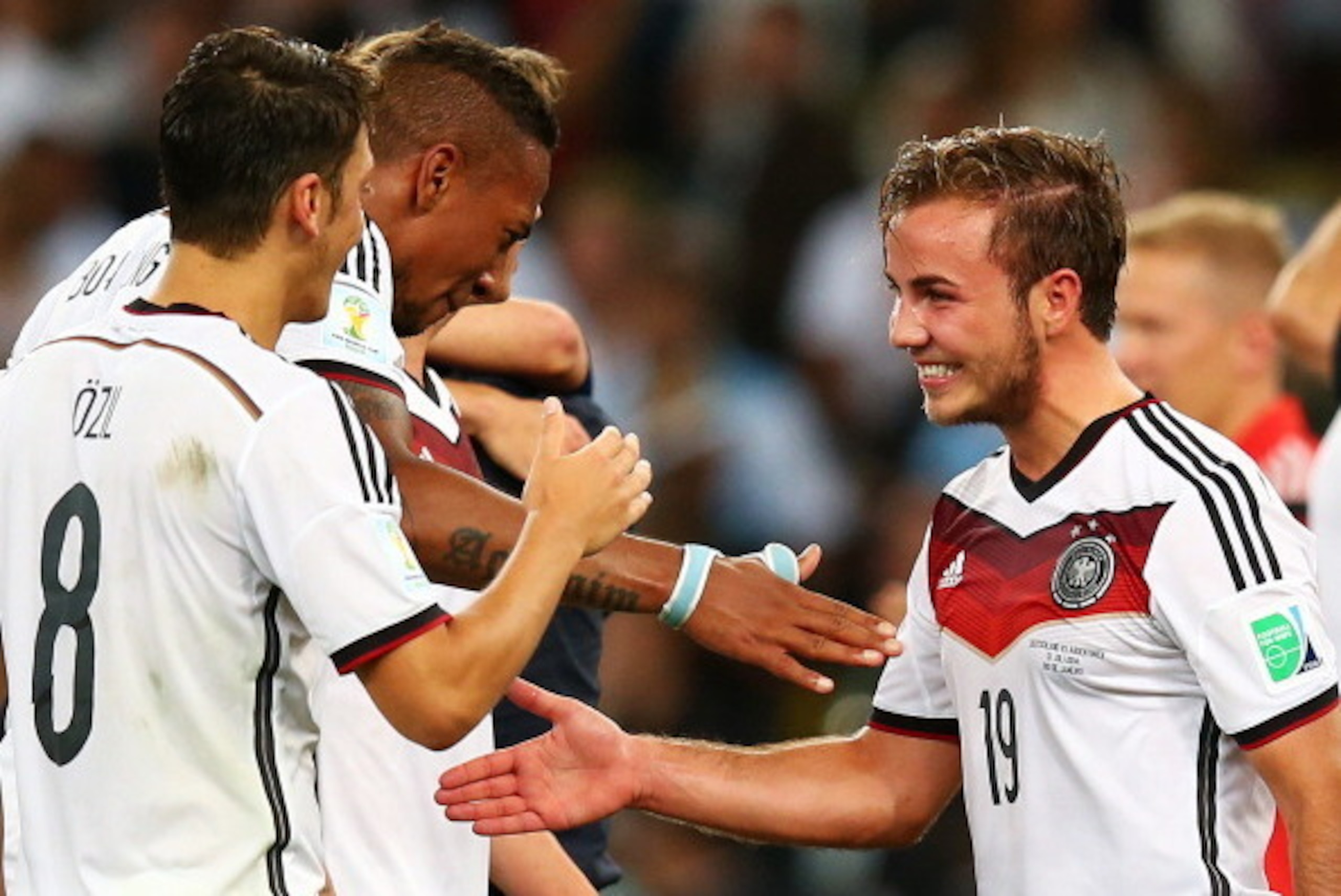 RIO DE JANEIRO, BRAZIL - JULY 13: Mesut Oezil, Jerome Boateng (C) and Mario Goetze of Germany celebrate after defeating Argentina 1-0 in extra time during the 2014 FIFA World Cup Brazil Final match between Germany and Argentina at Maracana on July 13, 20 RIO DE JANEIRO, BRAZIL - JULY 13: Mesut Oezil, Jerome Boateng (C) and Mario Goetze of Germany celebrate after defeating Argentina 1-0 in extra time during the 2014 FIFA World Cup Brazil Final match between Germany and Argentina at Maracana on July 13, 20