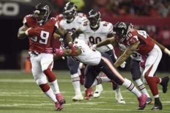 Oct 12, 2014; Atlanta, GA, USA; Atlanta Falcons running back Steven Jackson (39) runs against Chicago Bears inside linebacker Christian Jones (59) during the first quarter at the Georgia Dome. Mandatory Credit: Dale Zanine-USA TODAY Sports
