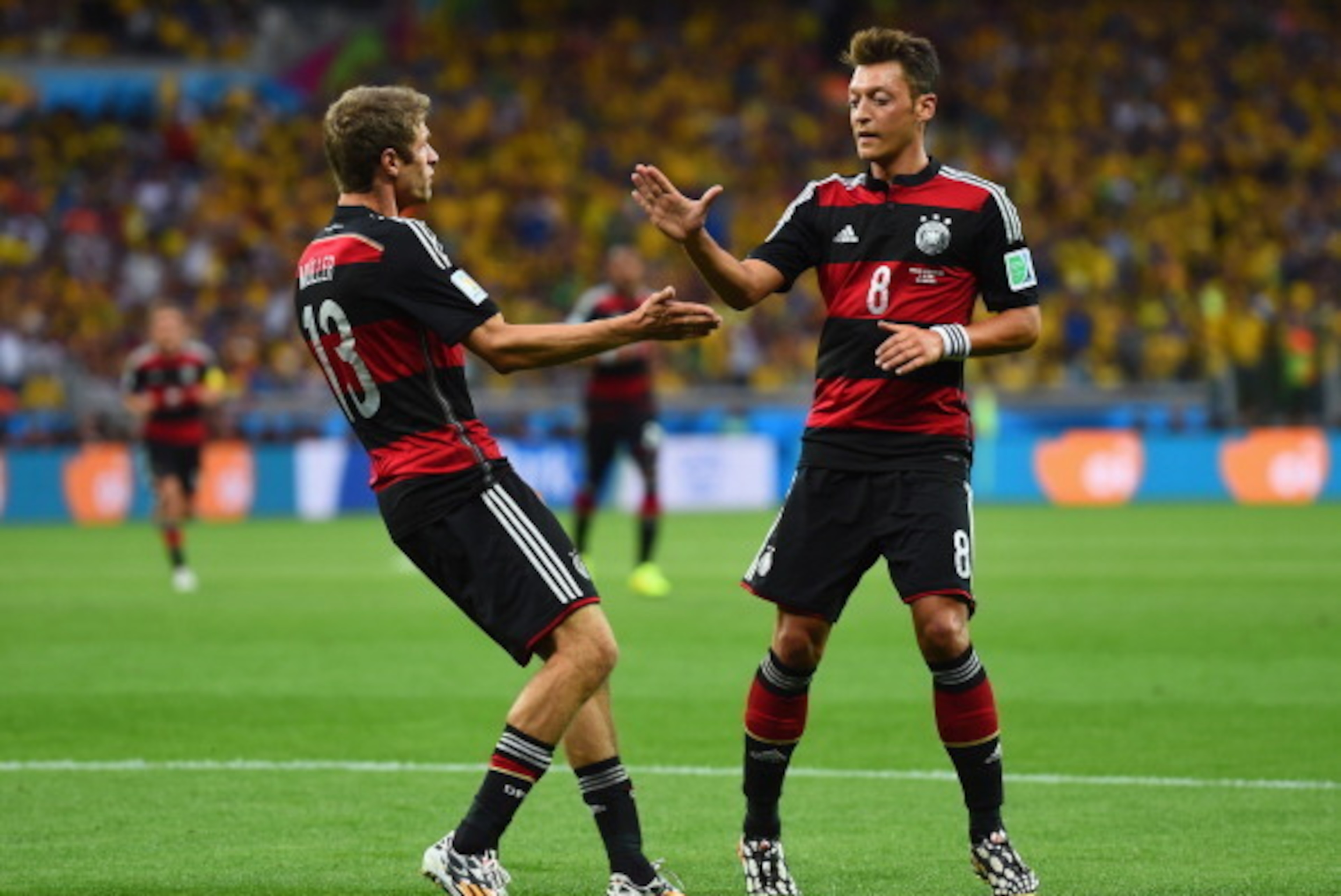 BELO HORIZONTE, BRAZIL - JULY 08: Thomas Mueller celebrates scoring his team's first goal with Mesut Oezil of Germany during the 2014 FIFA World Cup Brazil Semi Final match between Brazil and Germany at Estadio Mineirao on July 8, 2014 in Belo Horizonte, BELO HORIZONTE, BRAZIL - JULY 08: Thomas Mueller celebrates scoring his team's first goal with Mesut Oezil of Germany during the 2014 FIFA World Cup Brazil Semi Final match between Brazil and Germany at Estadio Mineirao on July 8, 2014 in Belo Horizonte,