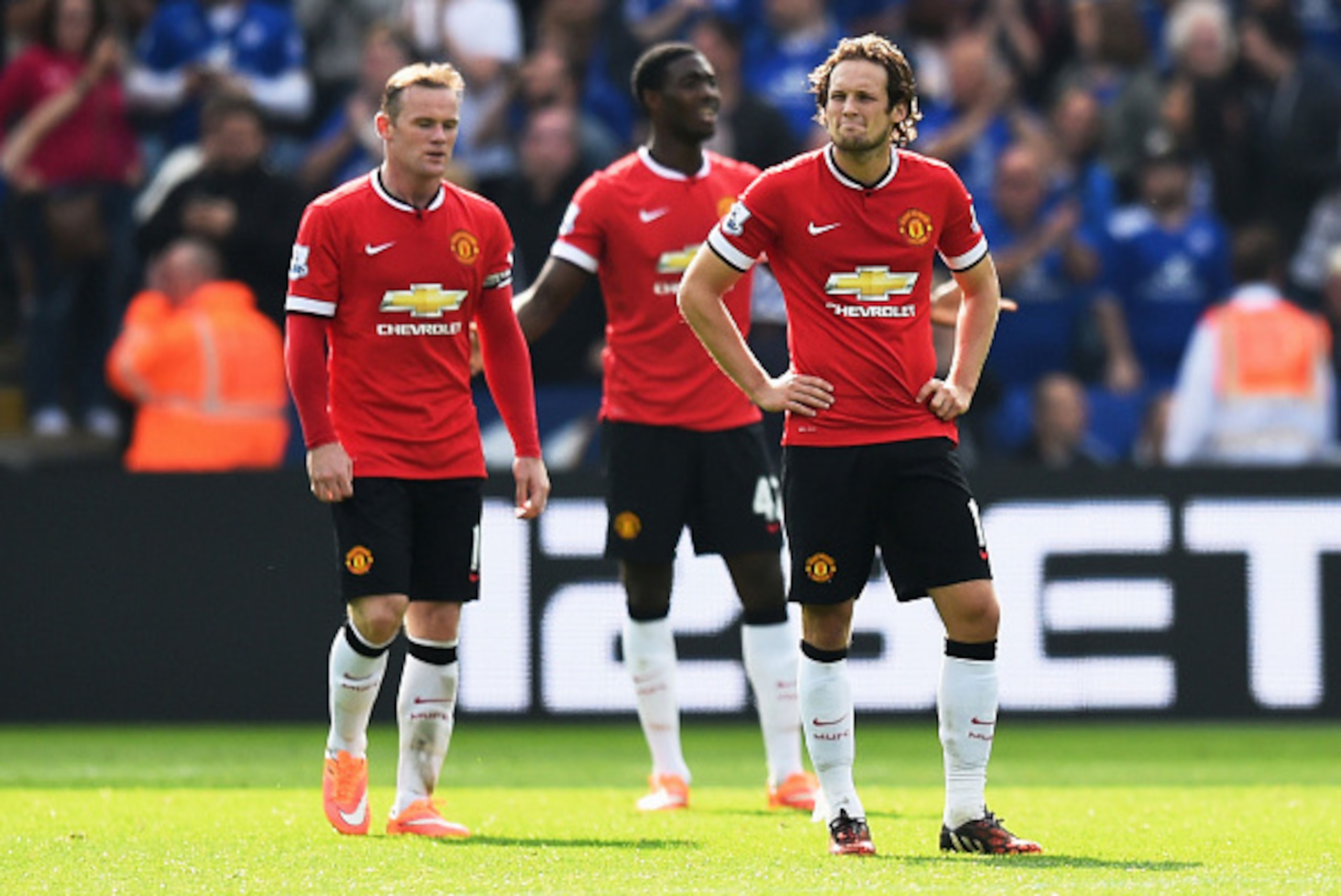 LEICESTER, ENGLAND - SEPTEMBER 21:  (L-R) Dejected Manchester United players Wayne Rooney, Tyler Blackett and Daley Blind look on during the Barclays Premier League match between Leicester City and Manchester United at The King Power Stadium on September 