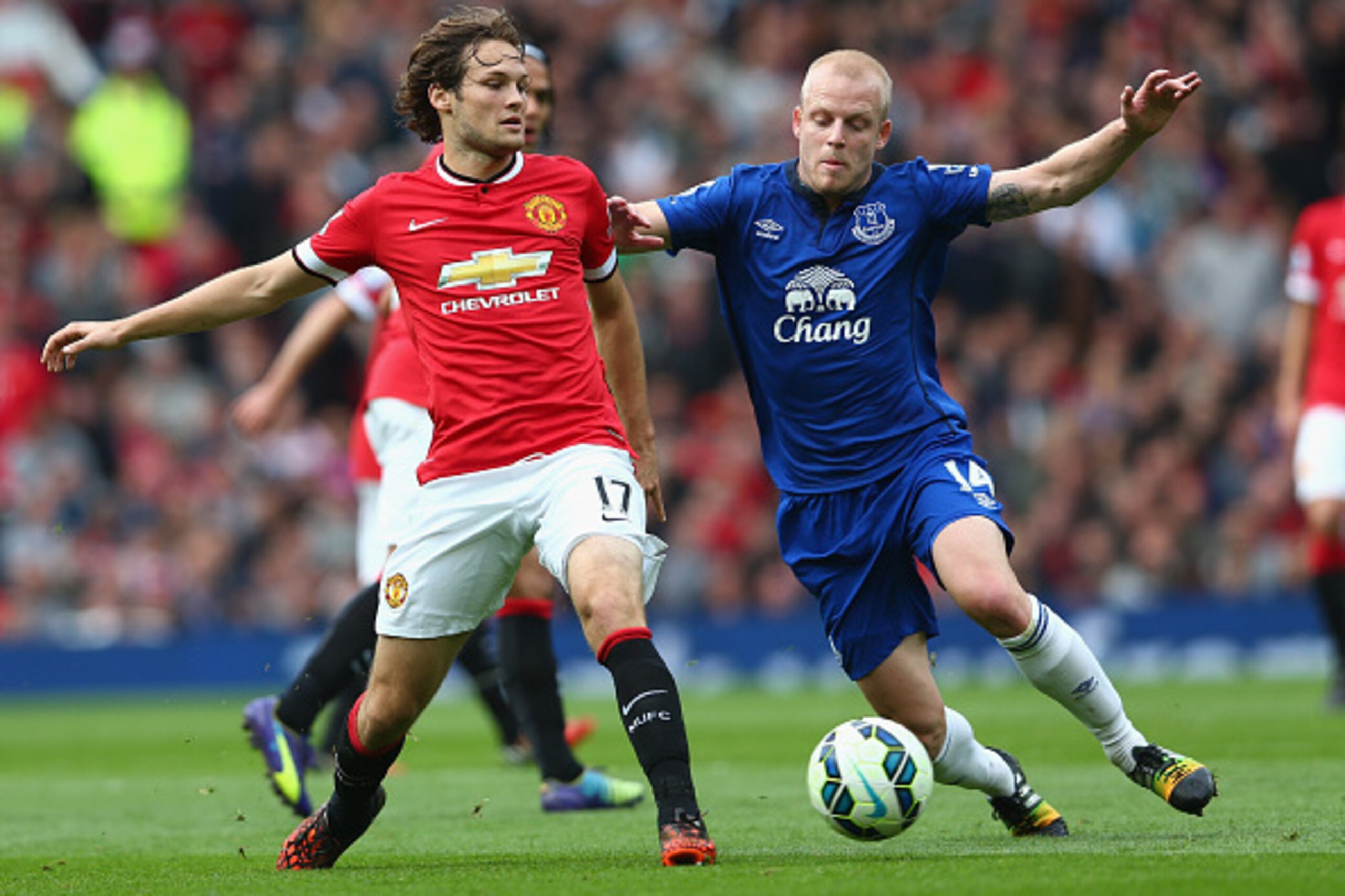 MANCHESTER, ENGLAND - OCTOBER 05:  Steven Naismith of Everton competes with Daley Blind of Manchester United during the Barclays Premier League match between Manchester United and Everton at Old Trafford on October 5, 2014 in Manchester, England.  (Photo 