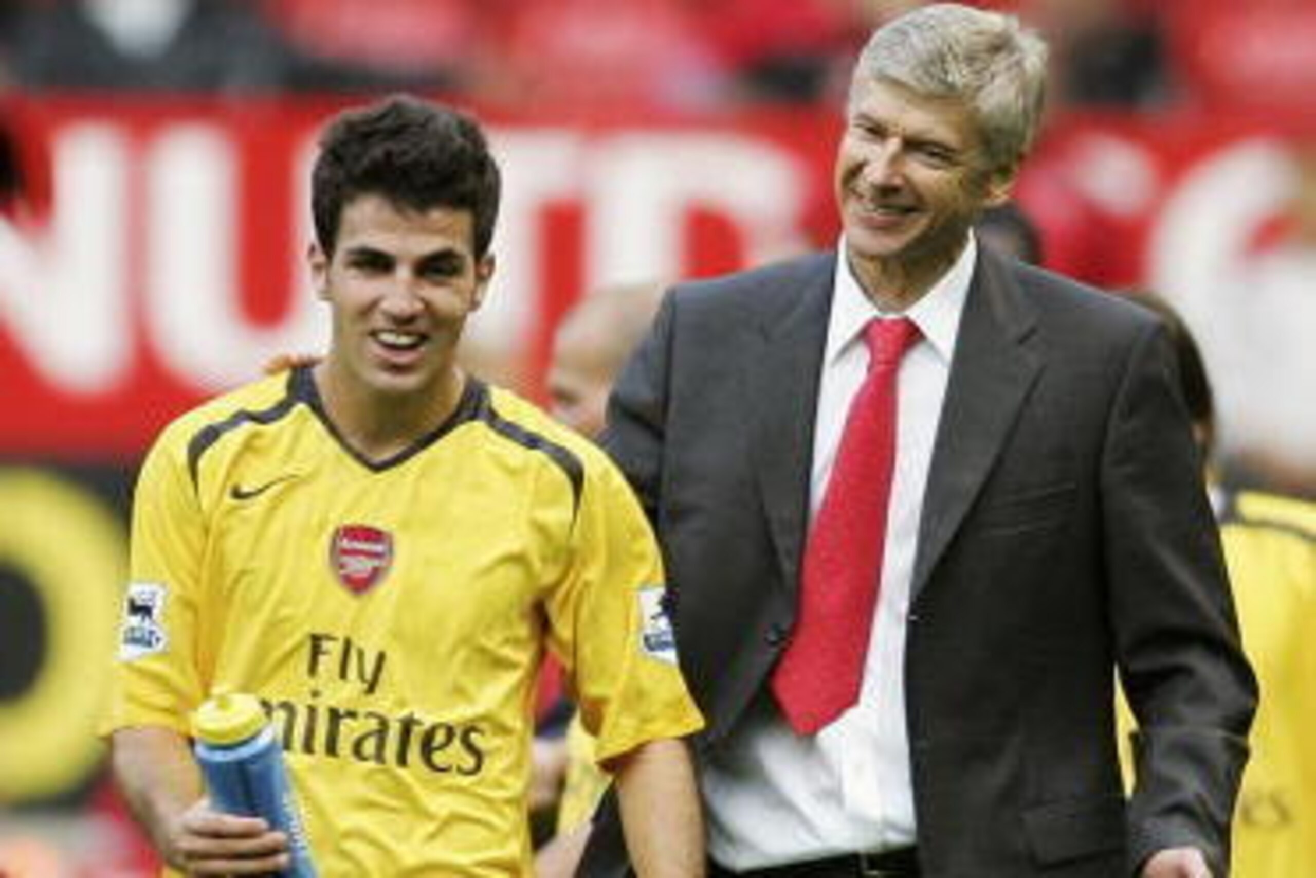 MANCHESTER, UNITED KINGDOM - SEPTEMBER 17:  Arsene Wenger (R) , the Arsenal manager congratulates Cesc Fabregas, following their team's 1-0 victory during the Barclays Premiership match between Manchester United and Arsenal at Old Trafford on September 17