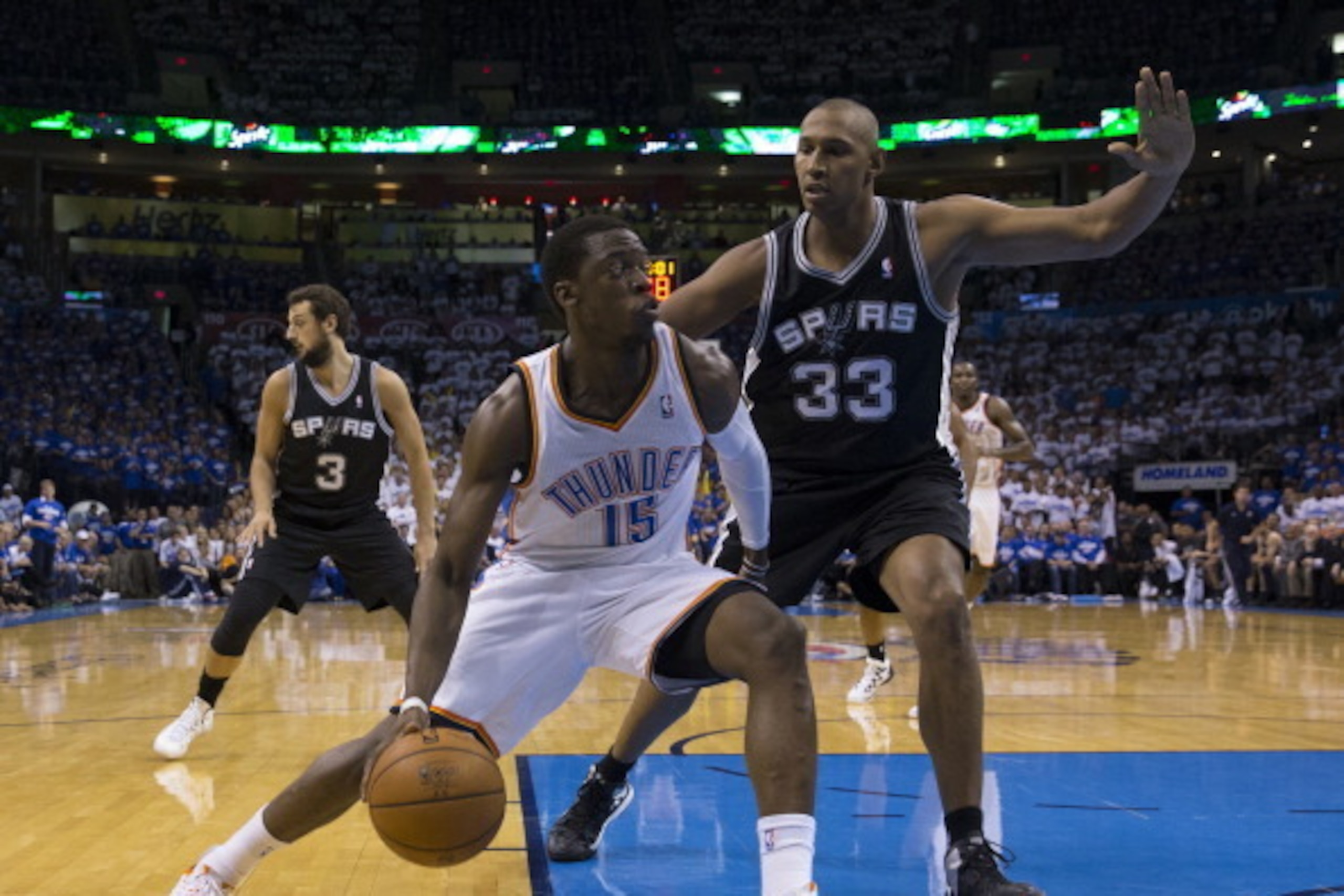 OKLAHOMA CITY, OK - May 27: Reggie Jackson #15 of the Oklahoma City Thunder goes up for the layup against the San Antonio Spurs in Game 4 of the Western Conference Finals during the 2014 NBA Playoffs at the Chesapeake Arena on May 27, 2014 in Oklahoma Cit