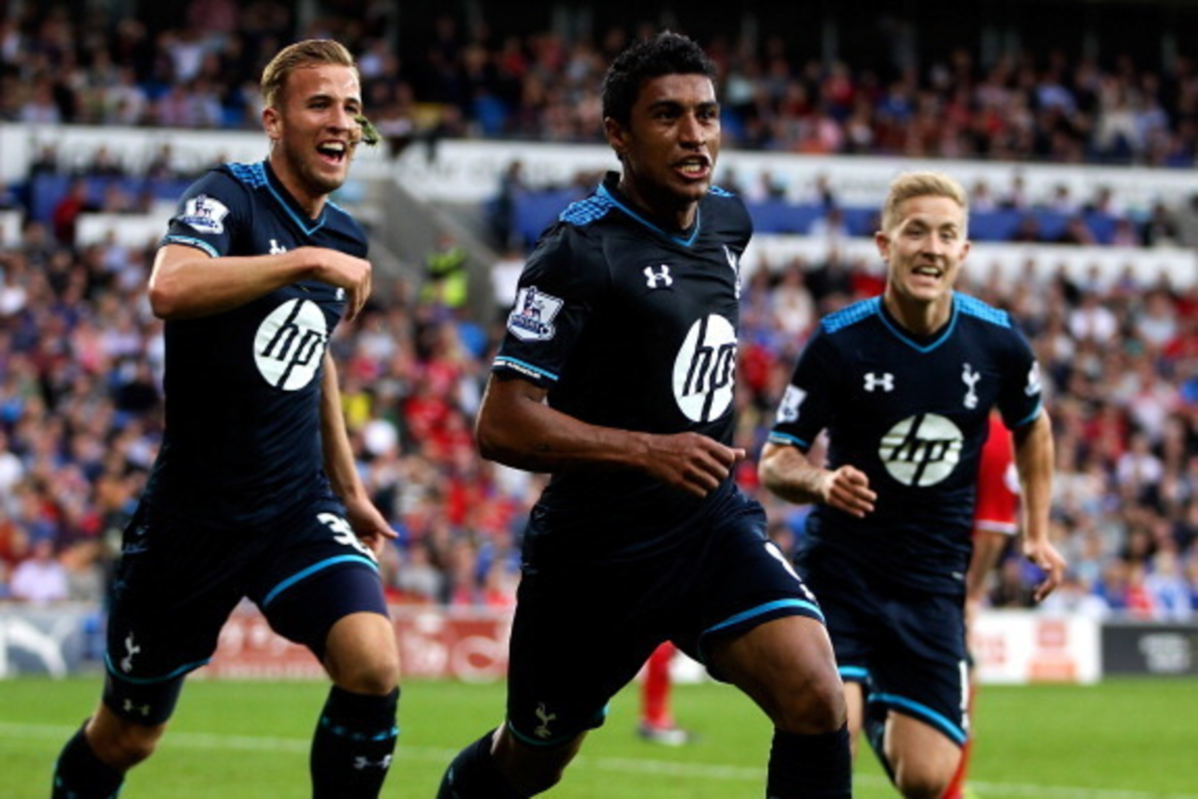 CARDIFF, WALES - SEPTEMBER 22:  Paulinho of Tottenham celebrates after scoring the winning goal during the Barclays Premier League match between Cardiff City and Tottenham Hotspur at Cardiff City Stadium on September 22, 2013 in Cardiff, Wales.  (Photo by