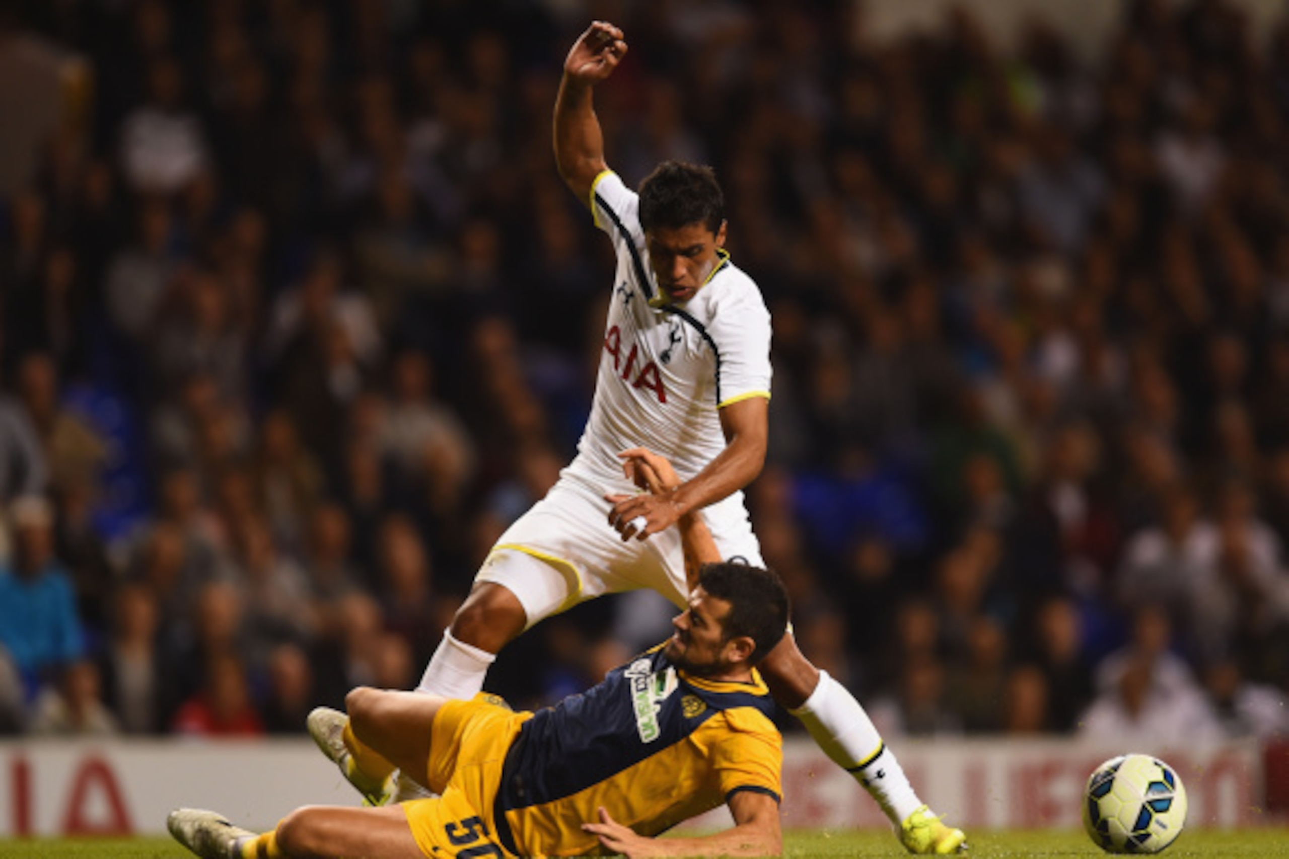 LONDON, ENGLAND - AUGUST 28: Paulinho of Spurs is tackled by Ricardo Manuel Ferreiras Sousa of AEL Limassol during the UEFA Europa League Qualifying Play-Offs Round Second Leg match between Tottenham Hotspur and AEL Limassol FC on August 28, 2014 in Lond LONDON, ENGLAND - AUGUST 28: Paulinho of Spurs is tackled by Ricardo Manuel Ferreiras Sousa of AEL Limassol during the UEFA Europa League Qualifying Play-Offs Round Second Leg match between Tottenham Hotspur and AEL Limassol FC on August 28, 2014 in Lond