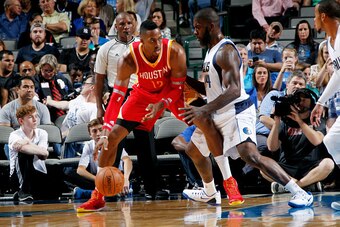 DALLAS, TX - OCTOBER 7: Dwight Howard #12 of the Houston Rockets posts up against Ivan Johnson #44 of the Dallas Mavericks on October 7, 2014 at the American Airlines Center in Dallas, Texas. NOTE TO USER: User expressly acknowledges and agrees that, by d