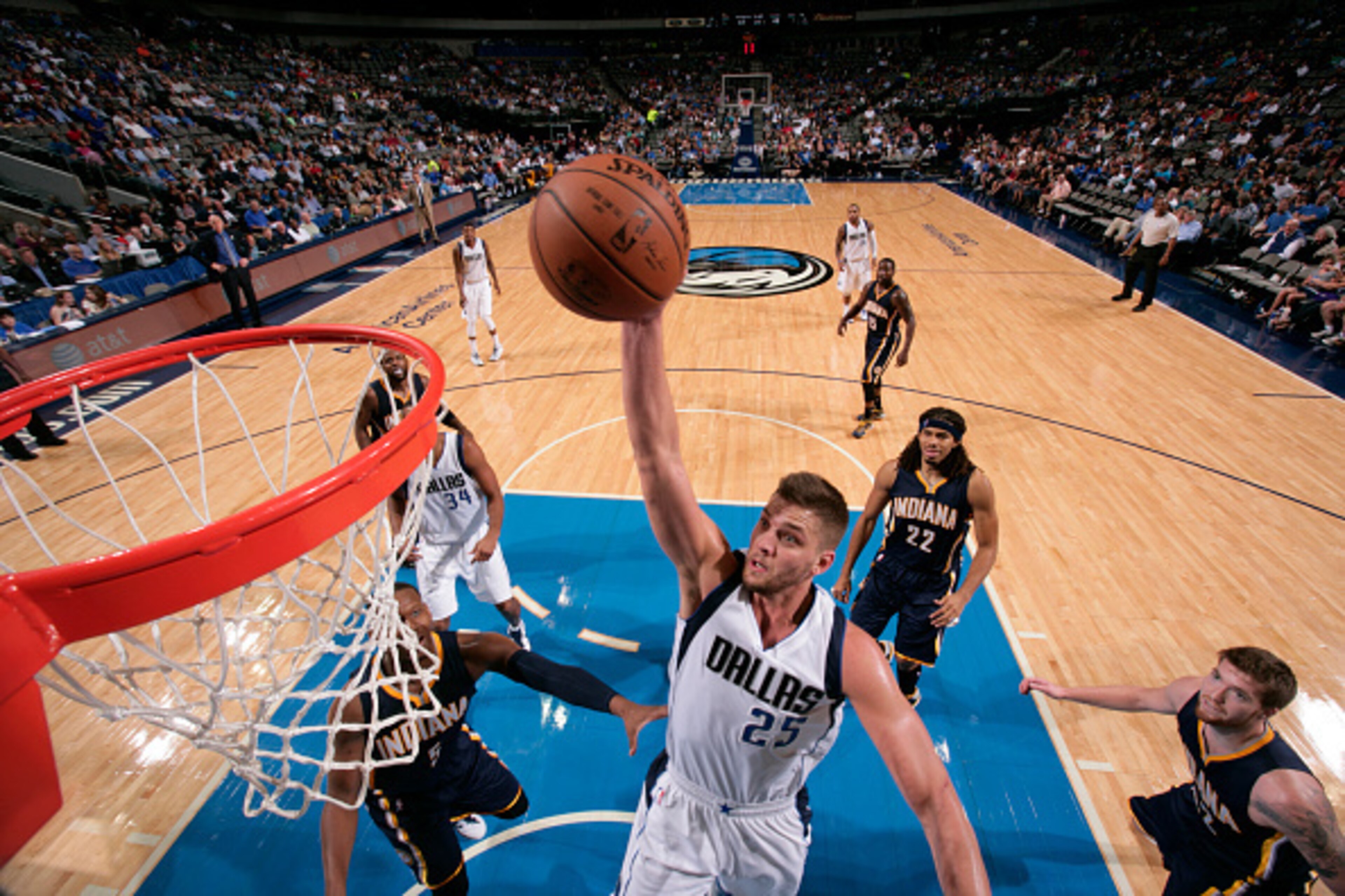 DALLAS, TX - OCTOBER 12: Chandler Parsons #25 of the Dallas Mavericks goes in for the dunk against the Indiana Pacers on October 12, 2014 at the American Airlines Center in Dallas, Texas. NOTE TO USER: User expressly acknowledges and agrees that, by downl