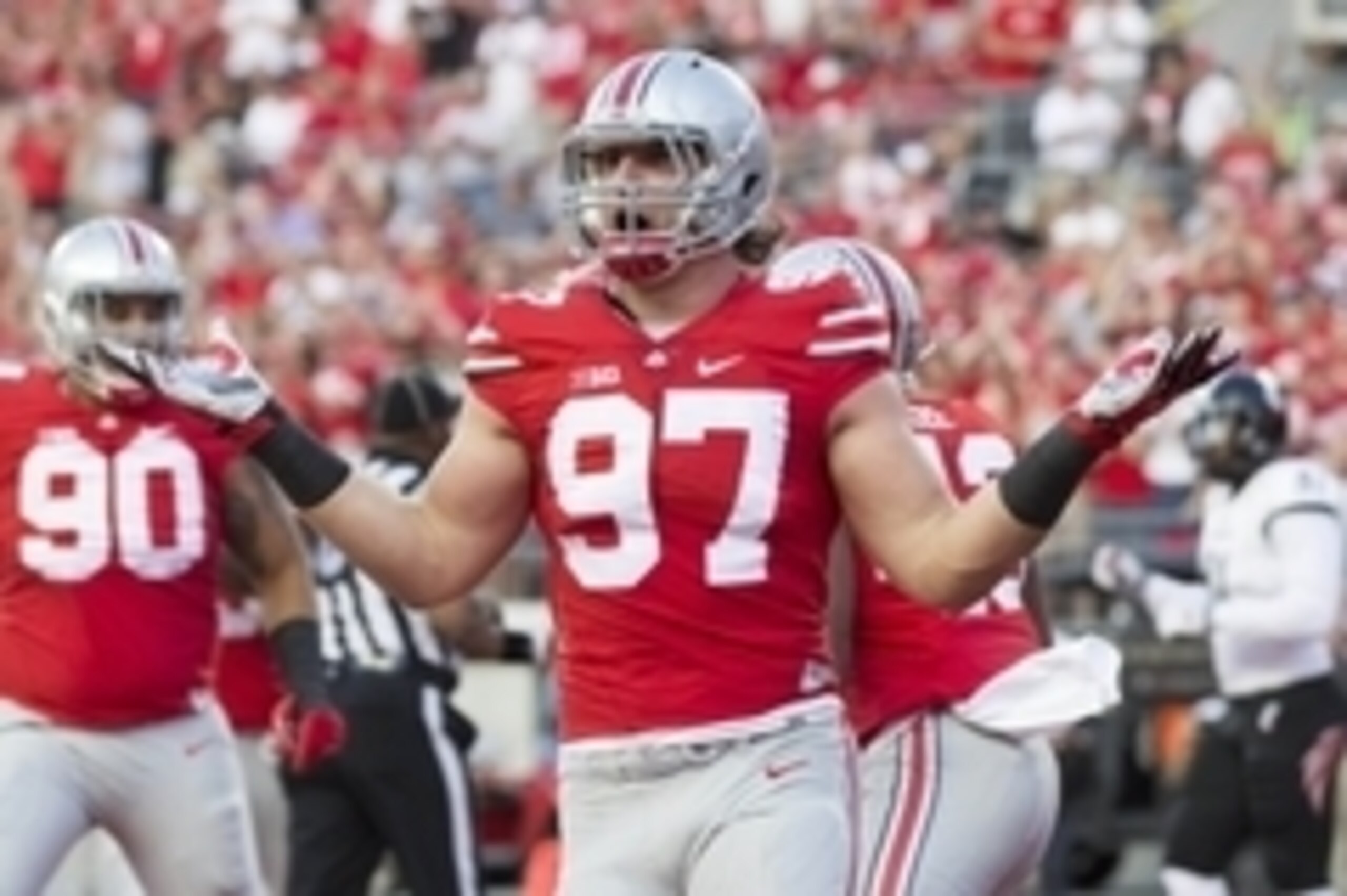 Sep 27, 2014; Columbus, OH, USA; Ohio State Buckeyes defensive lineman Joey Bosa (97) celebrates after forcing a turnover that led to a safety by the Cincinnati Bearcats at Ohio Stadium. Mandatory Credit: Greg Bartram-USA TODAY Sports