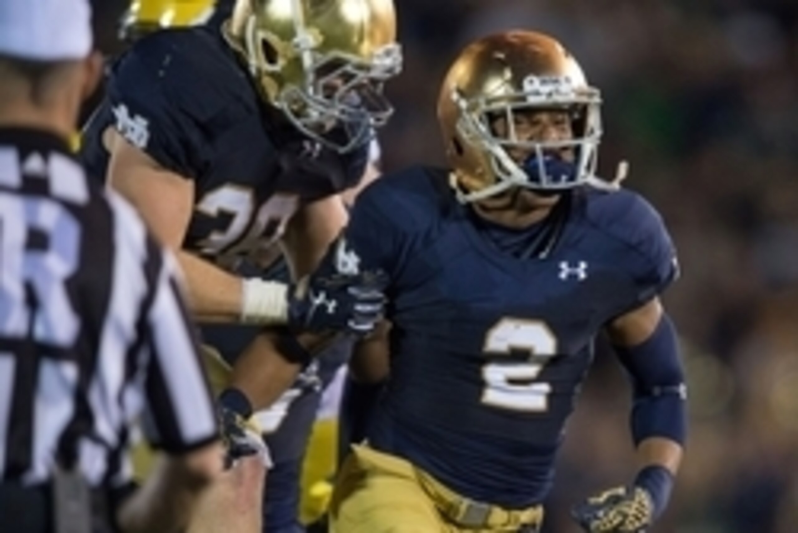 Sep 6, 2014; South Bend, IN, USA; Notre Dame Fighting Irish cornerback Cody Riggs (2) celebrates with linebacker Joe Schmidt (38) after an interception in the fourth quarter against the Michigan Wolverines at Notre Dame Stadium. Notre Dame won 31-0. Manda