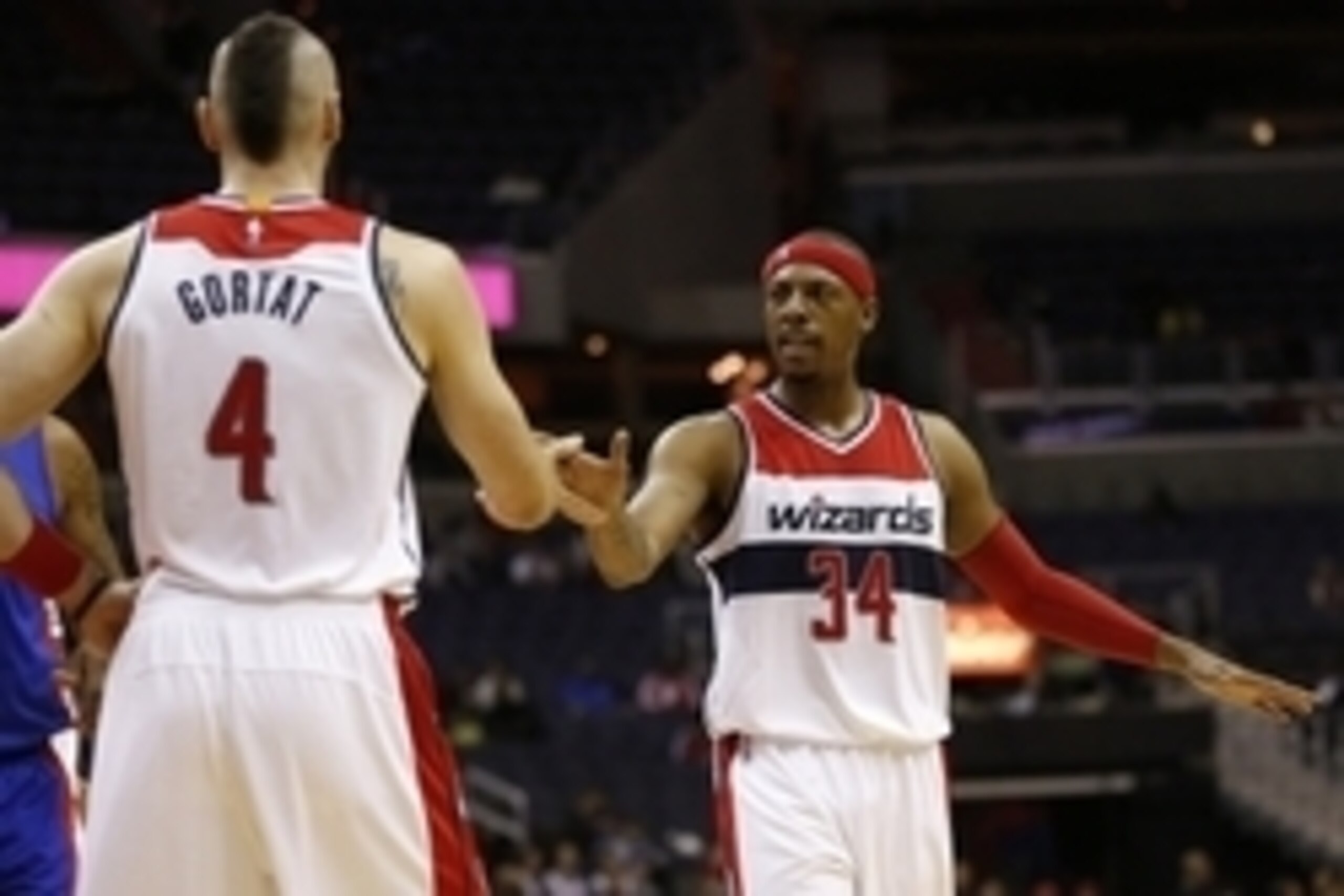 Oct 12, 2014; Washington, DC, USA; Washington Wizards forward Paul Pierce (34) congratulates Wizards center Marcin Gortat (4) on the court against the Detroit Pistons in the first quarter at Verizon Center. The Wizards won 91-89. Mandatory Credit: Geoff B Oct 12, 2014; Washington, DC, USA; Washington Wizards forward Paul Pierce (34) congratulates Wizards center Marcin Gortat (4) on the court against the Detroit Pistons in the first quarter at Verizon Center. The Wizards won 91-89. Mandatory Credit: Geoff B