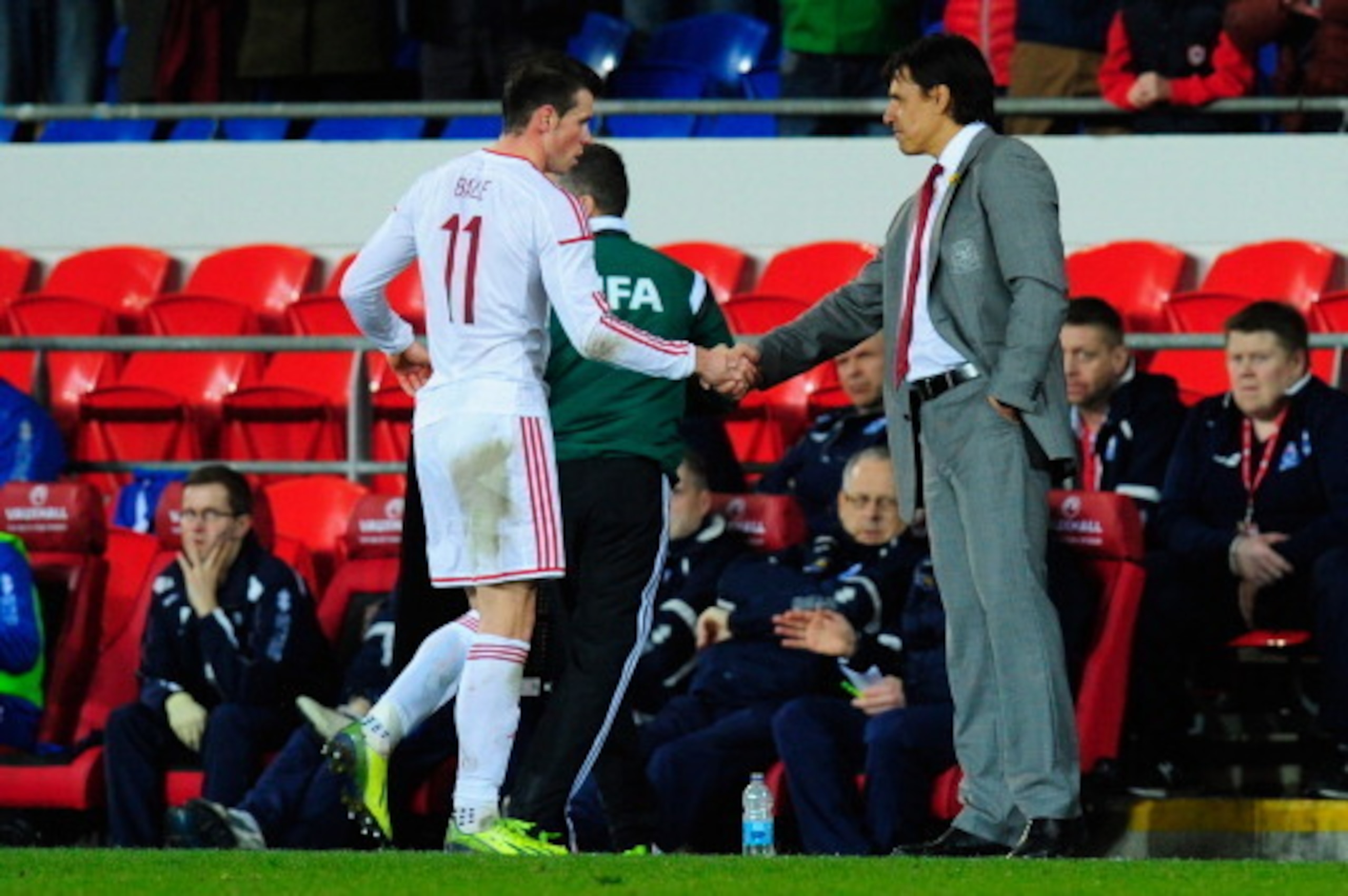 CARDIFF, WALES - MARCH 05:  Wales player Gareth Bale (l) is congratulated by manager Chris Coleman after being substituted after he had scored the third Wales goal during the International Friendly between Wales and Iceland at Cardiff City stadium on Marc