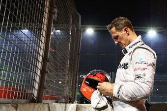 SINGAPORE - SEPTEMBER 23:  Michael Schumacher of Germany and Mercedes GP retires early after crashing into the back of Jean-Eric Vergne of France and Scuderia Toro Rosso during the Singapore Formula One Grand Prix at the Marina Bay Street Circuit on Septe