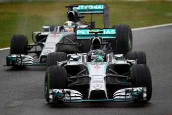 SUZUKA, JAPAN - OCTOBER 05:  Nico Rosberg of Germany and Mercedes GP leads teammate Lewis Hamilton of Great Britain and Mercedes GP during the Japanese Formula One Grand Prix at Suzuka Circuit on October 5, 2014 in Suzuka, Japan.  (Photo by Clive Rose/Get