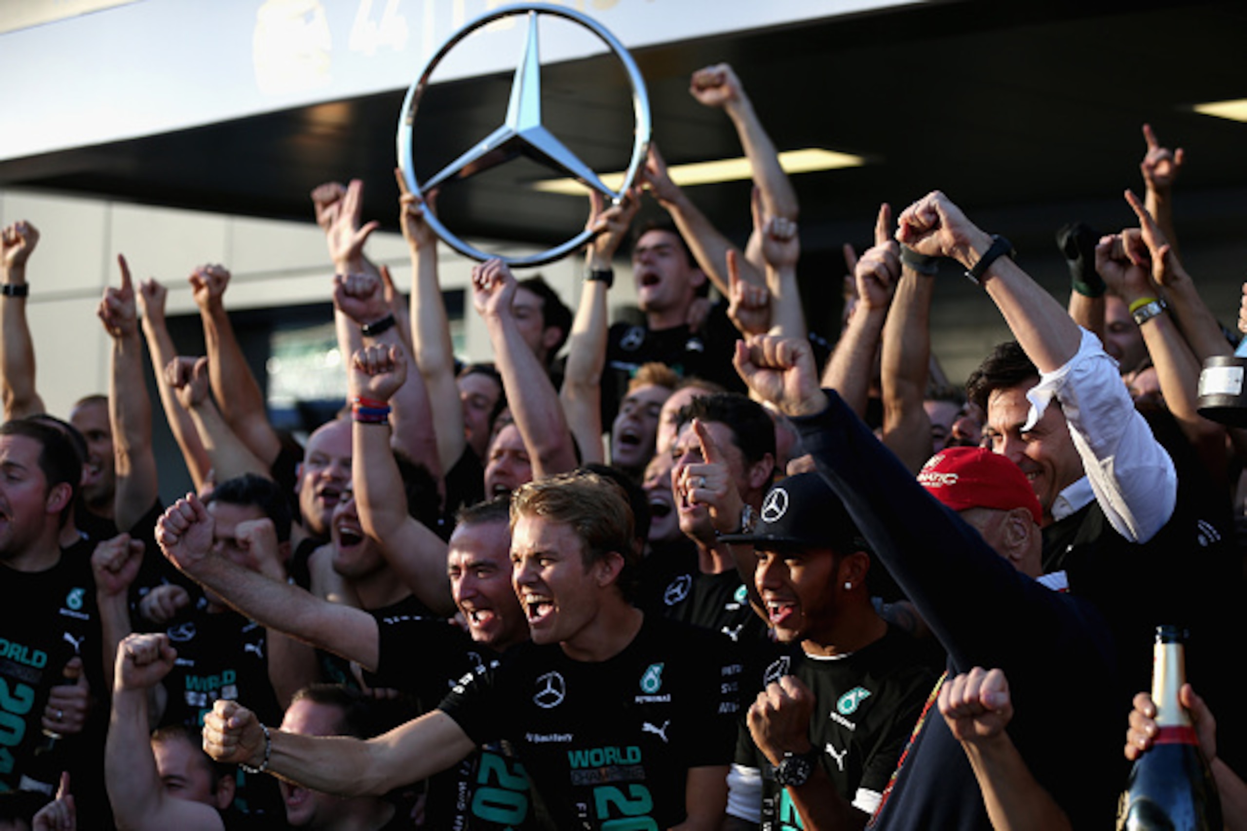 SOCHI, RUSSIA - OCTOBER 12:  Paddy Lowe the Executive Director of Mercedes GP, Lewis Hamilton of Great Britain and Mercedes GP, Nico Rosberg of Germany and Mercedes GP and Niki Lauda, non-executive chairman of Mercedes GP celebrate with the team after bec