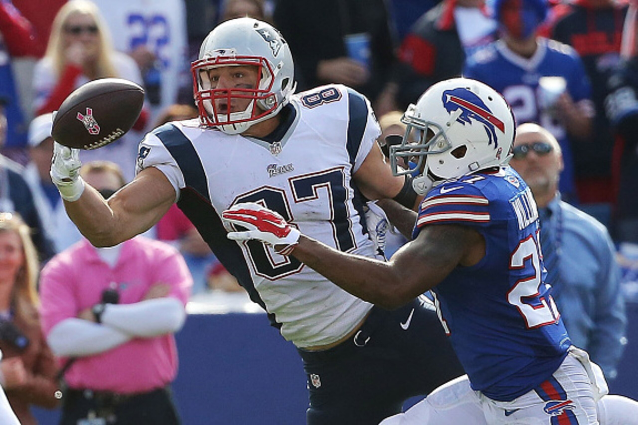 ORCHARD PARK, NY - OCTOBER 12:   Rob Gronkowski #87 of the New England Patriots makes a catch in front of  Duke Williams #27 of the Buffalo Bills during the second half at Ralph Wilson Stadium on October 12, 2014 in Orchard Park, New York.  (Photo by Tom 