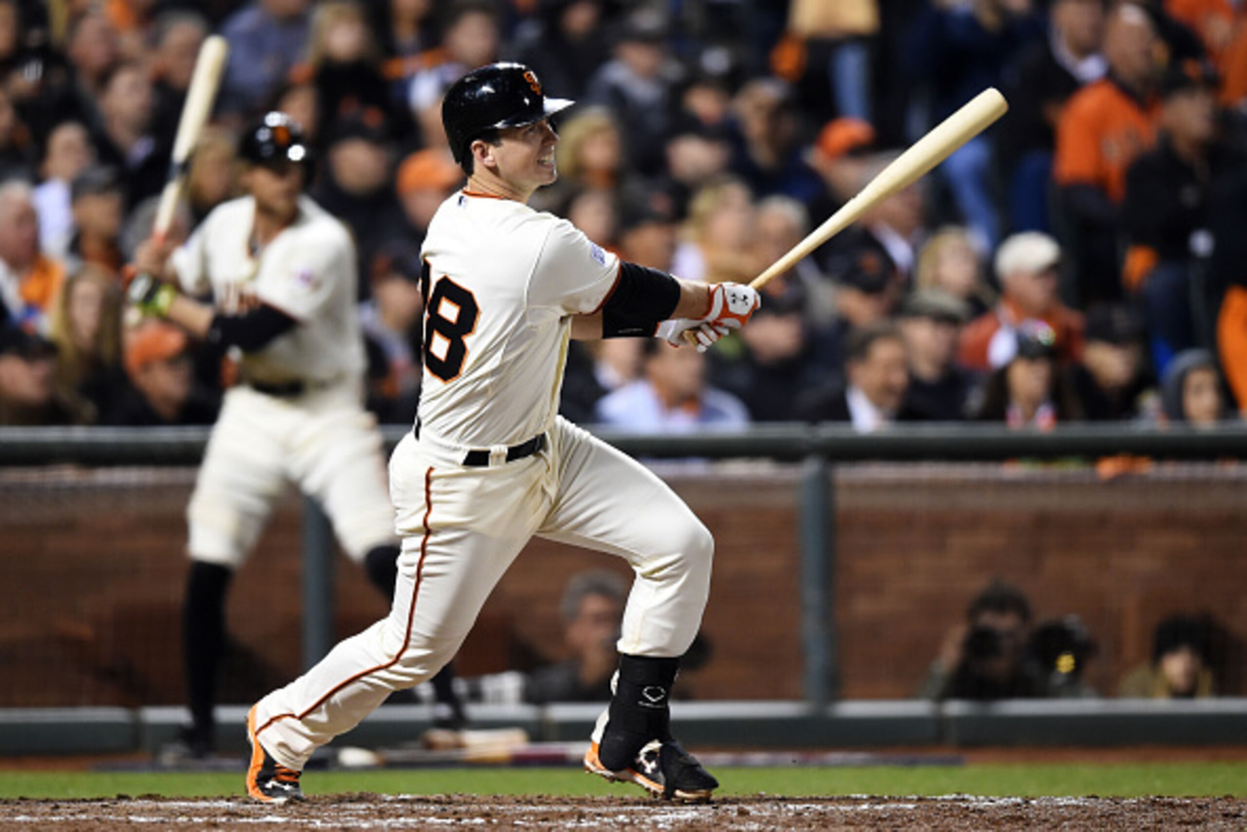 SAN FRANCISCO, CA - OCTOBER 07:  Buster Posey #28 of the San Francisco Giants ihts a single in the seventh inning against the Washington Nationals during Game Four of the National League Division Series at AT&T Park on October 7, 2014 in San Francisco, Ca