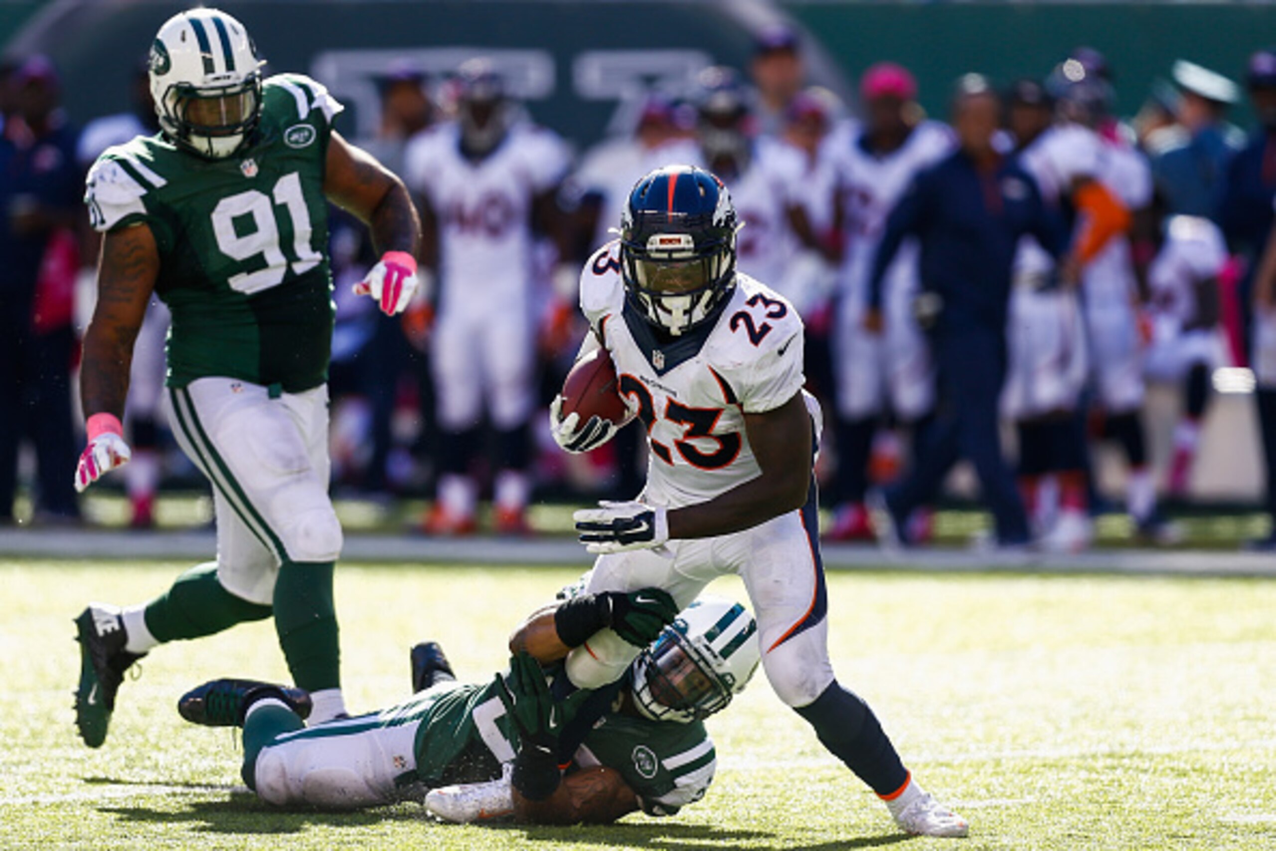 EAST RUTHERFORD, NJ - OCTOBER 12: Sheldon Richardson #91 and Dawan Landry #26 of the New York Jets attempt to tackle Ronnie Hillman #23 of the Denver Broncos in the third quarter at MetLife Stadium on October 12, 2014 in East Rutherford, New Jersey. (Pho EAST RUTHERFORD, NJ - OCTOBER 12: Sheldon Richardson #91 and Dawan Landry #26 of the New York Jets attempt to tackle Ronnie Hillman #23 of the Denver Broncos in the third quarter at MetLife Stadium on October 12, 2014 in East Rutherford, New Jersey. (Pho
