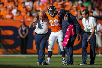 DENVER, CO - OCTOBER 5:  Running back Montee Ball #28 of the Denver Broncos is helped off the field after an injury during a game against the Arizona Cardinals at Sports Authority Field at Mile High on October 5, 2014 in Denver, Colorado.  (Photo by Justi