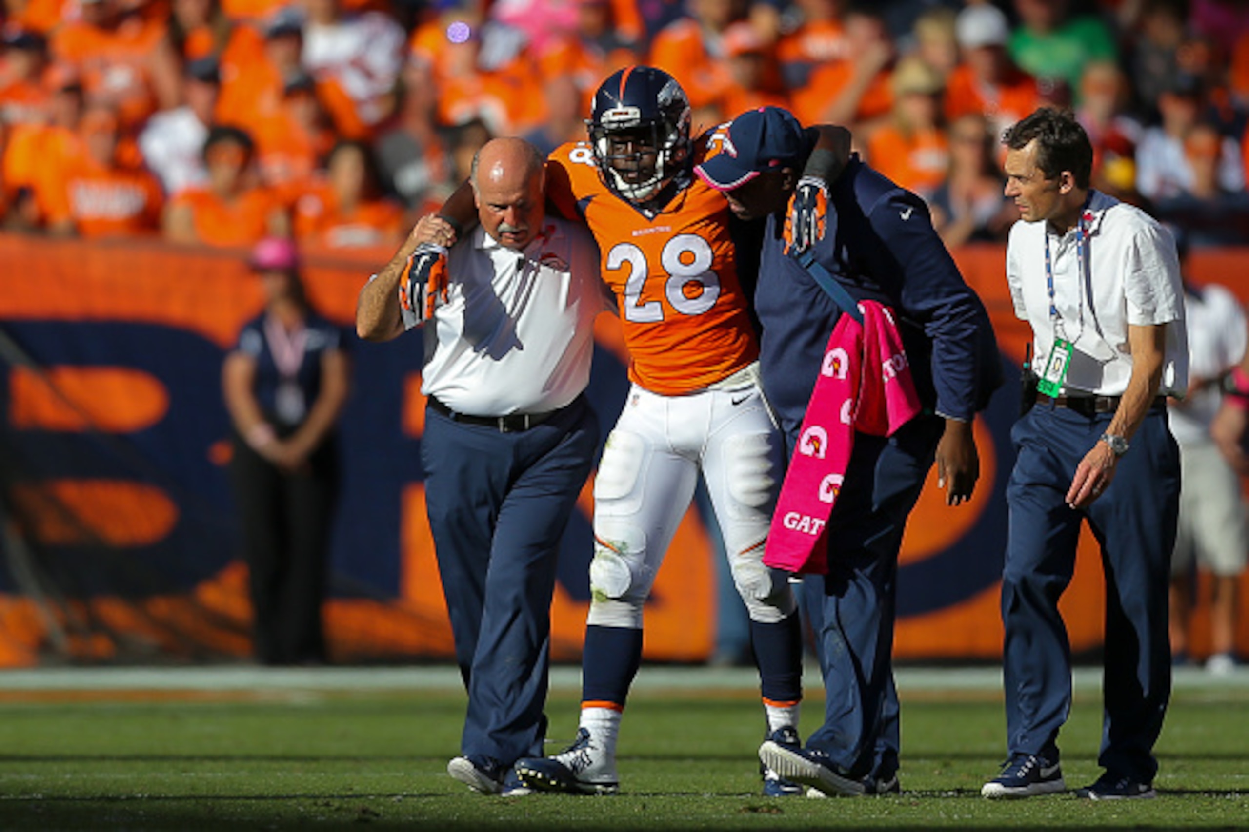 DENVER, CO - OCTOBER 5: Running back Montee Ball #28 of the Denver Broncos is helped off the field after an injury during a game against the Arizona Cardinals at Sports Authority Field at Mile High on October 5, 2014 in Denver, Colorado. (Photo by Justi DENVER, CO - OCTOBER 5: Running back Montee Ball #28 of the Denver Broncos is helped off the field after an injury during a game against the Arizona Cardinals at Sports Authority Field at Mile High on October 5, 2014 in Denver, Colorado. (Photo by Justi