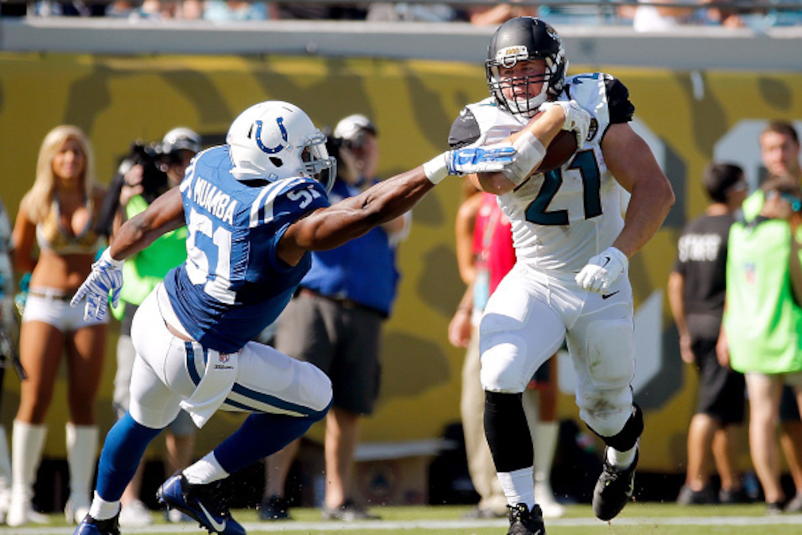 JACKSONVILLE, FL - SEPTEMBER 21: Toby Gerhart #21 of the Jacksonville Jaguars runs with the ball against Henoc Muamba #51 of the Indianapolis Colts during the second half of the game at EverBank Field on September 21, 2014 in Jacksonville, Florida. (Phot JACKSONVILLE, FL - SEPTEMBER 21: Toby Gerhart #21 of the Jacksonville Jaguars runs with the ball against Henoc Muamba #51 of the Indianapolis Colts during the second half of the game at EverBank Field on September 21, 2014 in Jacksonville, Florida. (Phot