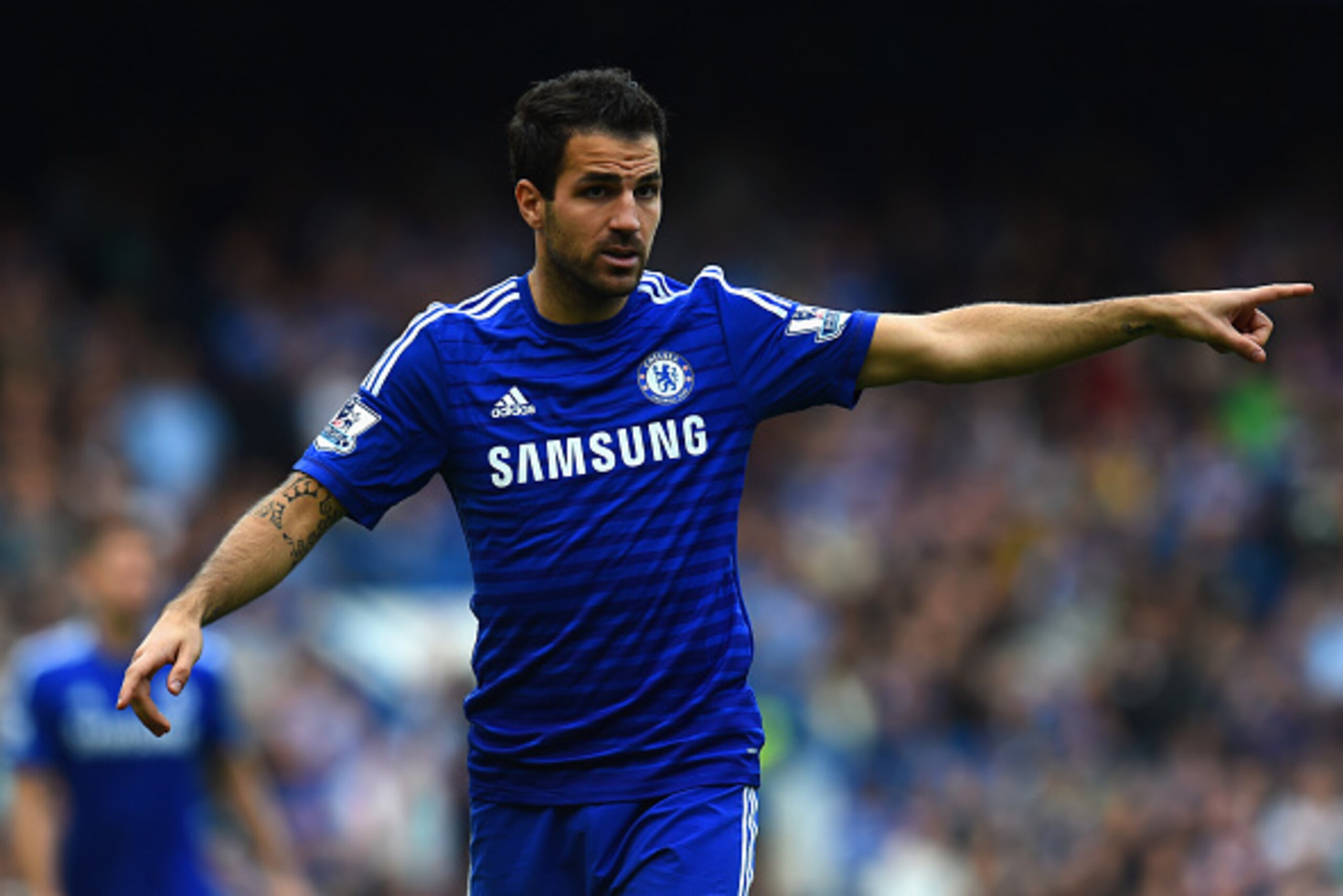 LONDON, ENGLAND - OCTOBER 05:  Cesc Fabregas of Chelsea points during the Barclays Premier League match between Chelsea and Arsenal at Stamford Bridge on October 4, 2014 in London, England.  (Photo by Shaun Botterill/Getty Images)