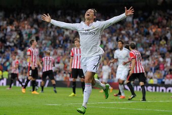 MADRID, SPAIN - OCTOBER 05:  Cristiano Ronaldo of Real Madrid celebrates after scoring his team's 5th and his third goal against Club Athletic during the La Liga match between Real Madrid CF and Athletic Club at Estadio Santiago Bernabeu on October 5, 201