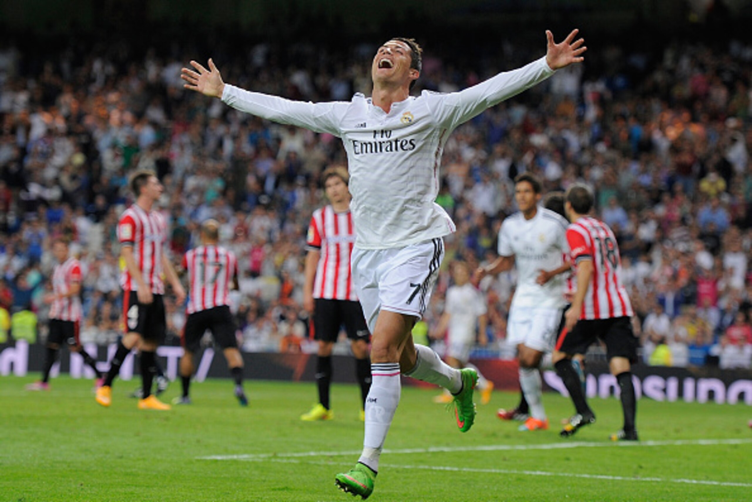 MADRID, SPAIN - OCTOBER 05:  Cristiano Ronaldo of Real Madrid celebrates after scoring his team's 5th and his third goal against Club Athletic during the La Liga match between Real Madrid CF and Athletic Club at Estadio Santiago Bernabeu on October 5, 201