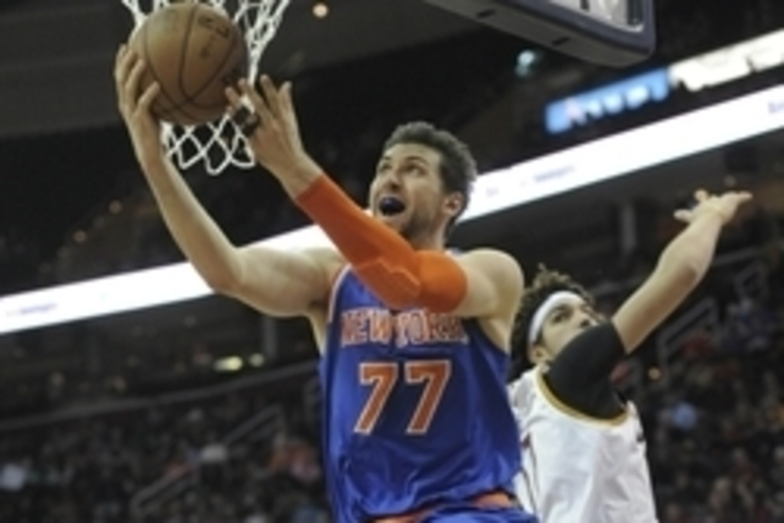 Dec 10, 2013; Cleveland, OH, USA; New York Knicks power forward Andrea Bargnani (77) drives to the basket against the Cleveland Cavaliers in the fourth quarter at Quicken Loans Arena. Mandatory Credit: David Richard-USA TODAY Sports